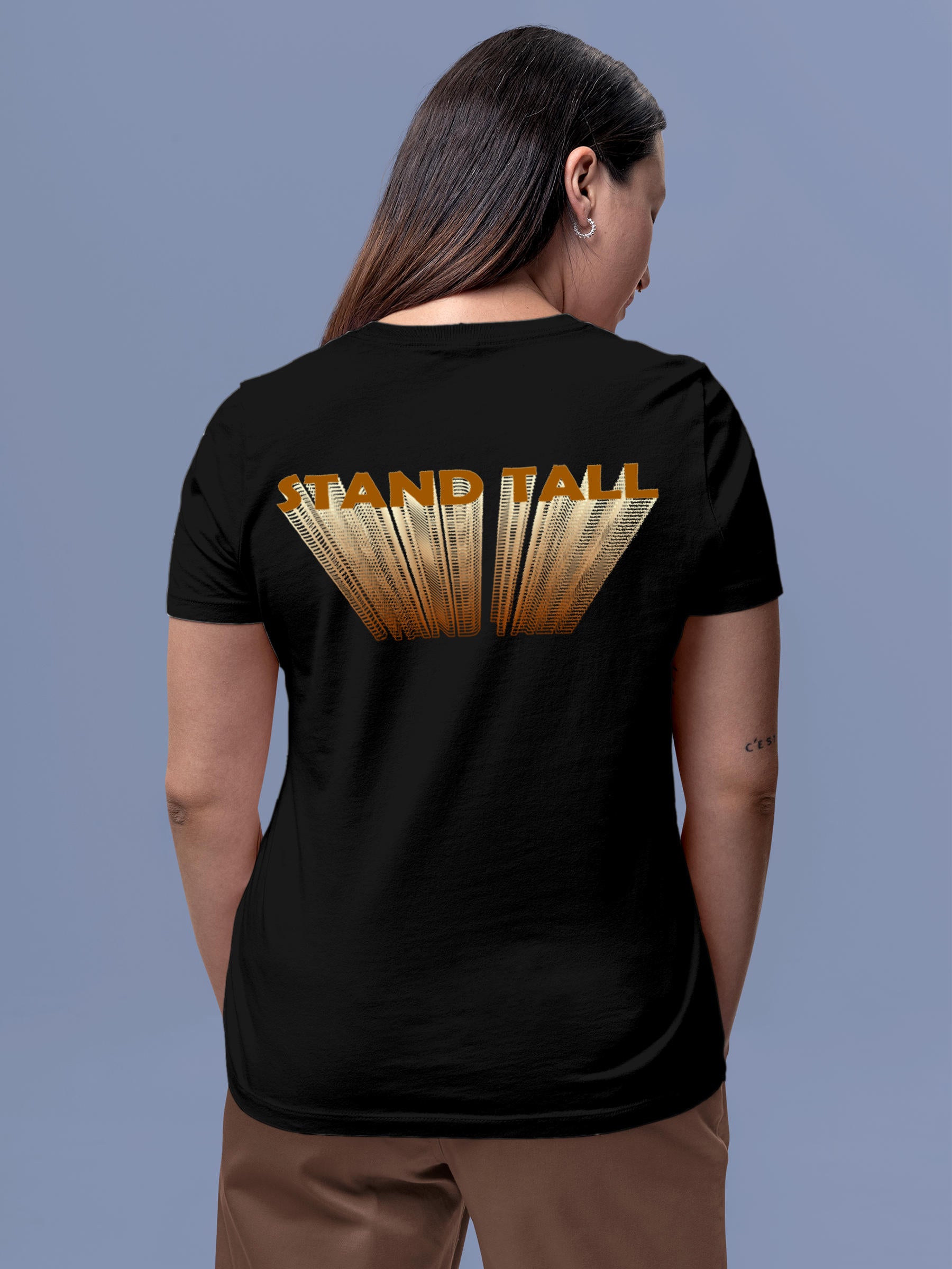 Model wearing Women's Black Round Neck T-shirt with 'Stand Tall' design, offering effortless style and premium comfort