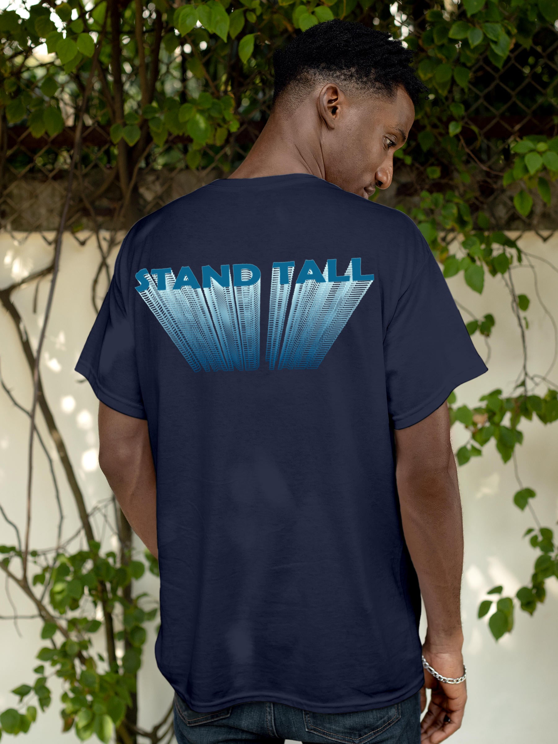 Model wearing Men's Navy Blue Round Neck T-shirt with 'Stand Tall' design, offering effortless style and premium comfort