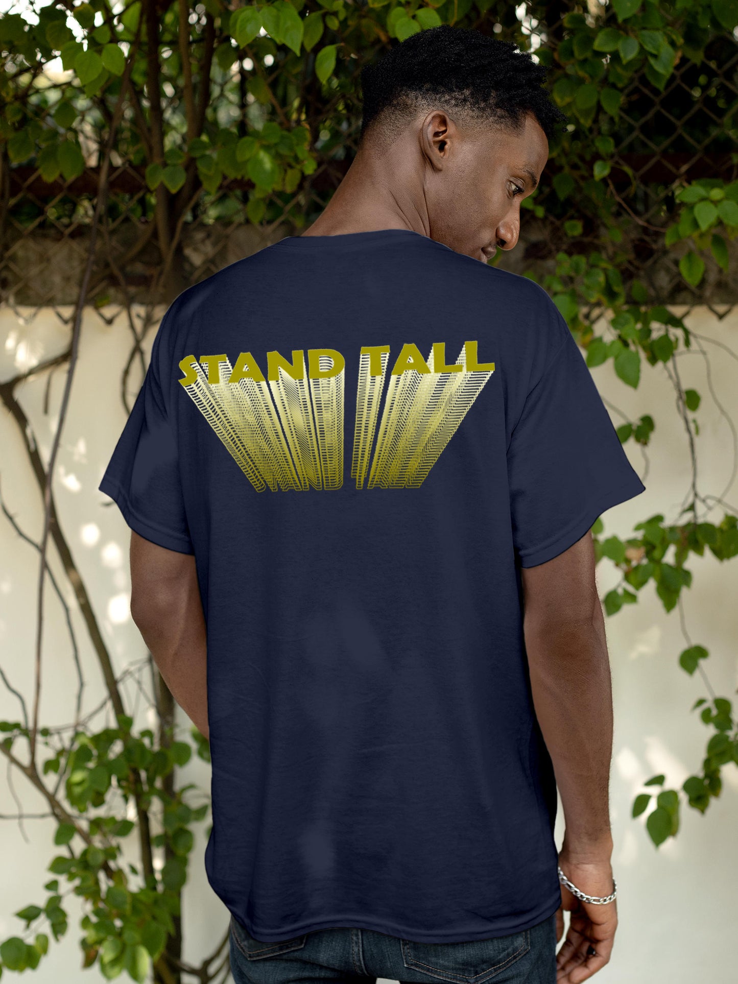 Model wearing Men's Navy Blue Round Neck T-shirt with 'Stand Tall' design, offering effortless style and premium comfort