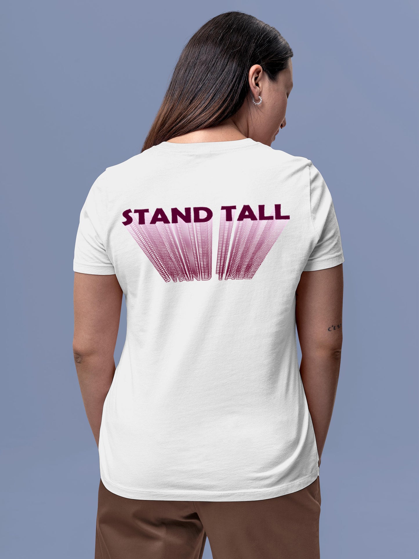 Model wearing Women's White Round Neck T-shirt with 'Stand Tall' design, offering effortless style and premium comfort