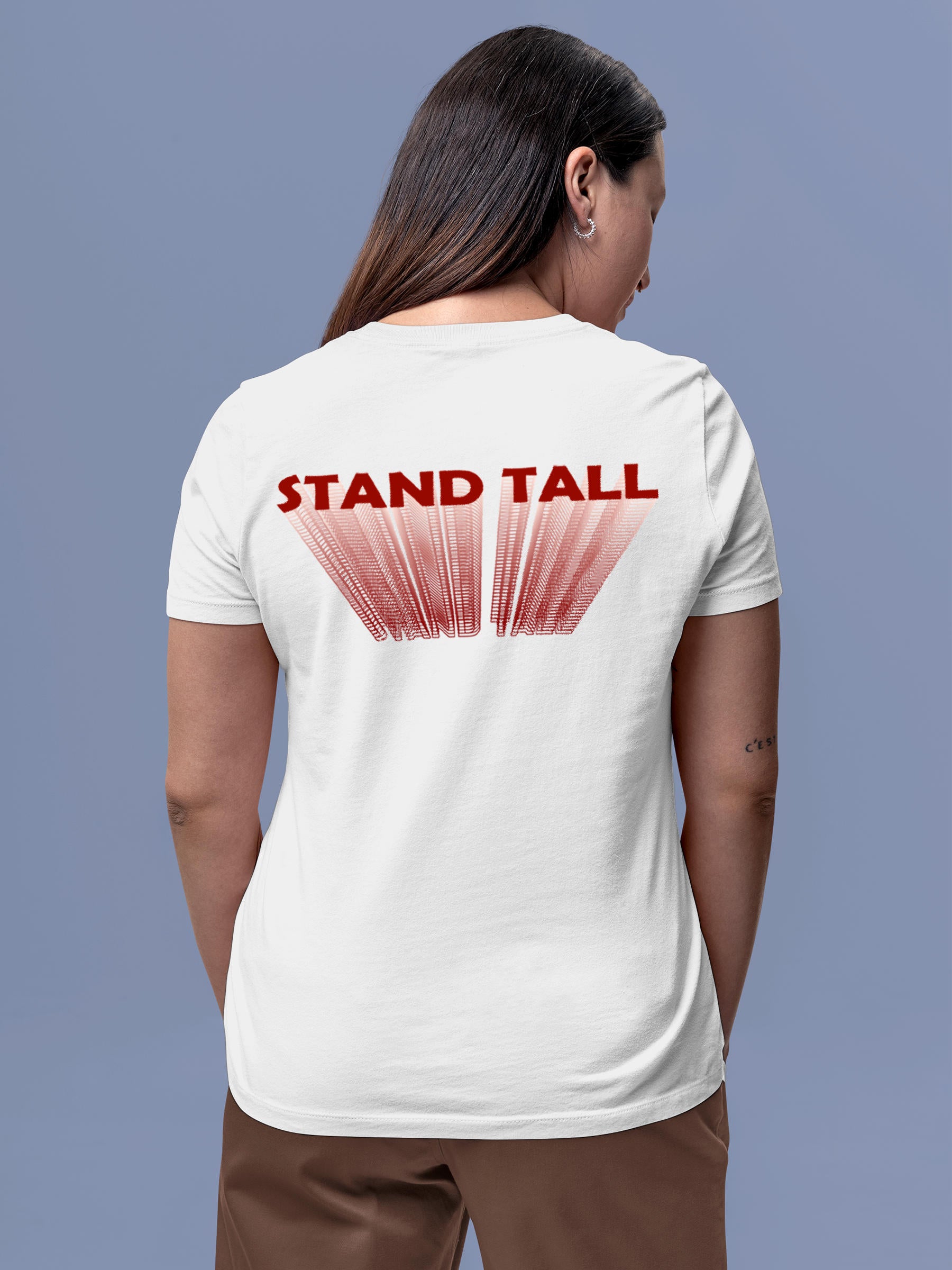 Model wearing Women's White Round Neck T-shirt with 'Stand Tall' design, offering effortless style and premium comfort