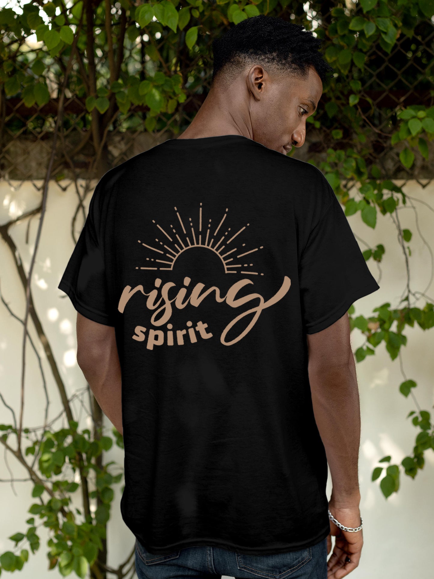 Model wearing Men's Black Round Neck T-shirt with 'Rising Spirit' design, offering effortless style and premium comfort