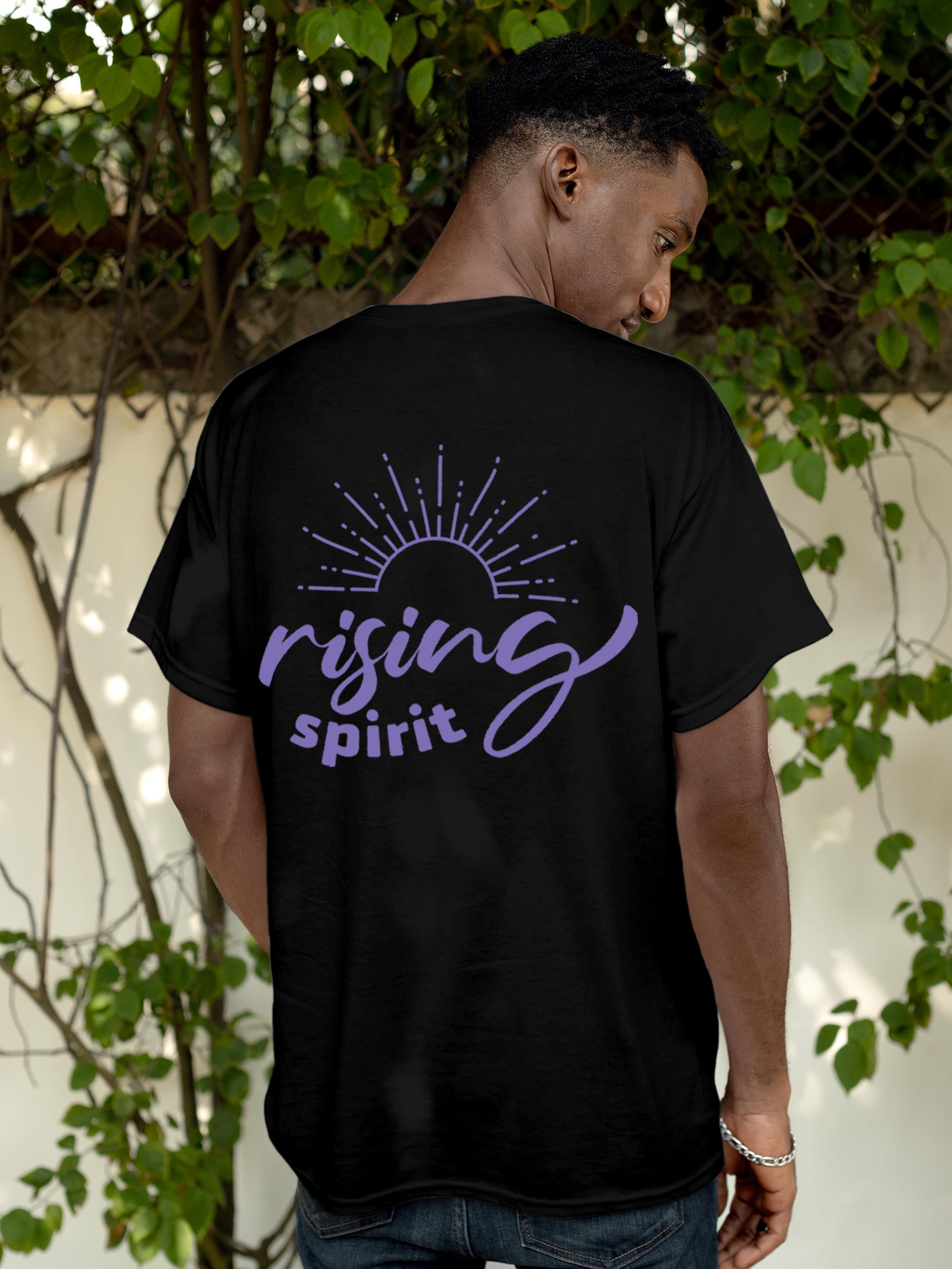 Model wearing Men's Black Round Neck T-shirt with 'Rising Spirit' design, offering effortless style and premium comfort