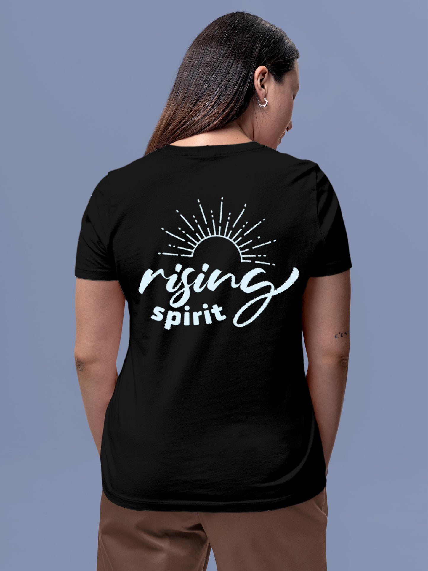 Model wearing Women's Black Round Neck T-shirt with 'Rising Spirit' design, offering effortless style and premium comfort
