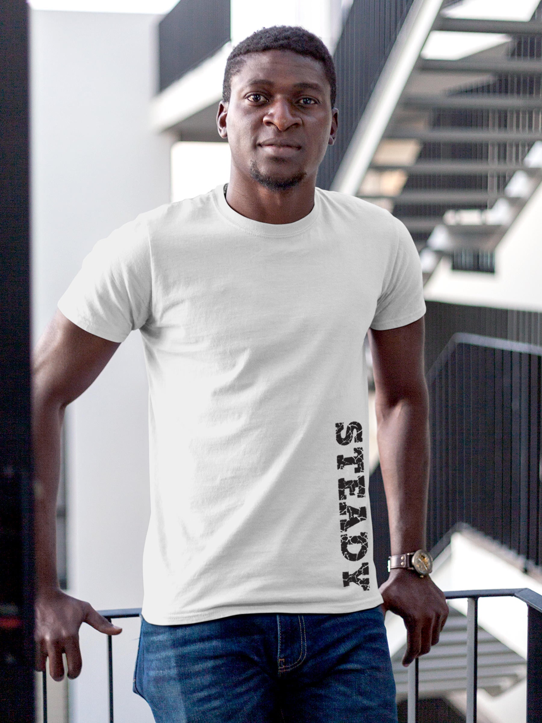 Model wearing Men's White Round Neck T-shirt with 'Steady' design, offering effortless style and premium comfort
