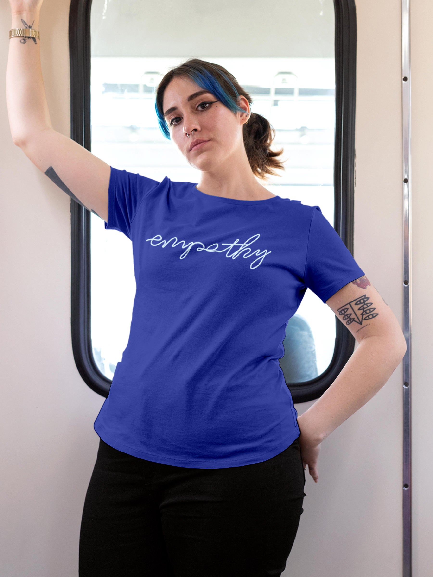 Model wearing Women's Blue Round Neck T-shirt with 'Empathy' design, offering effortless style and premium comfort