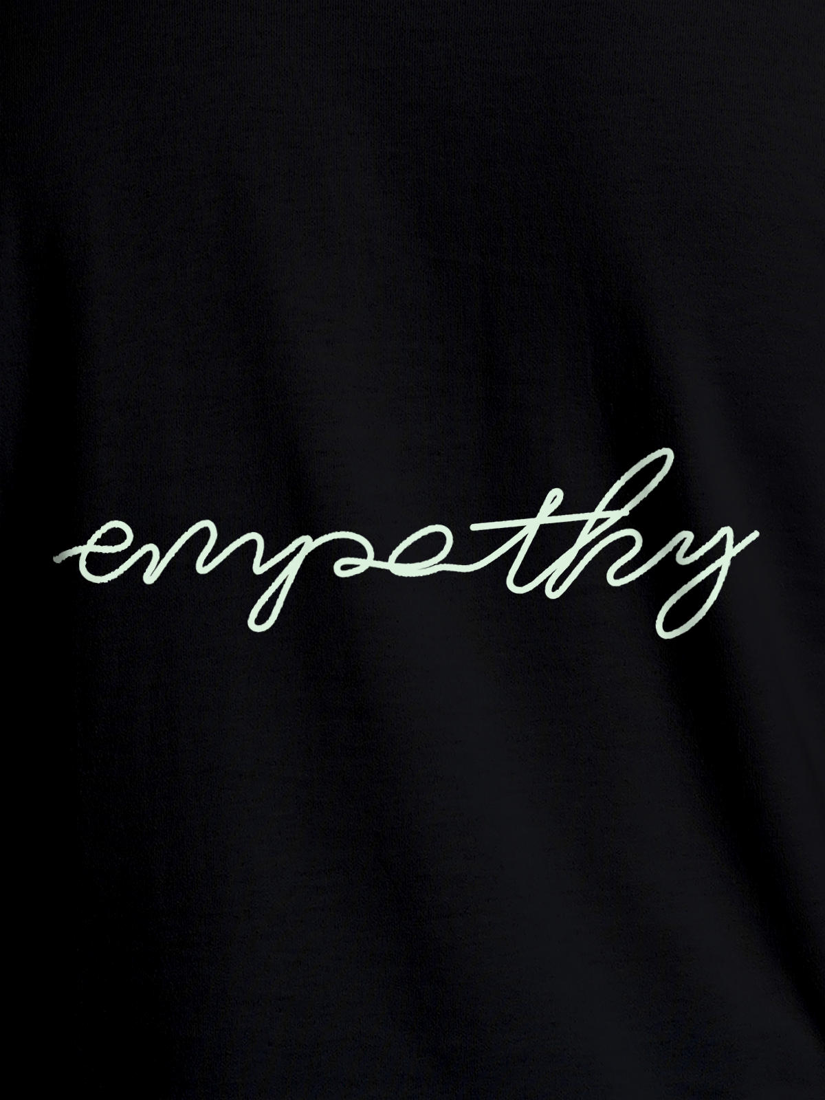 Close up of 'Empathy' design on Women's Black Round Neck T-shirt, highlighting intricate details and vibrant print.
