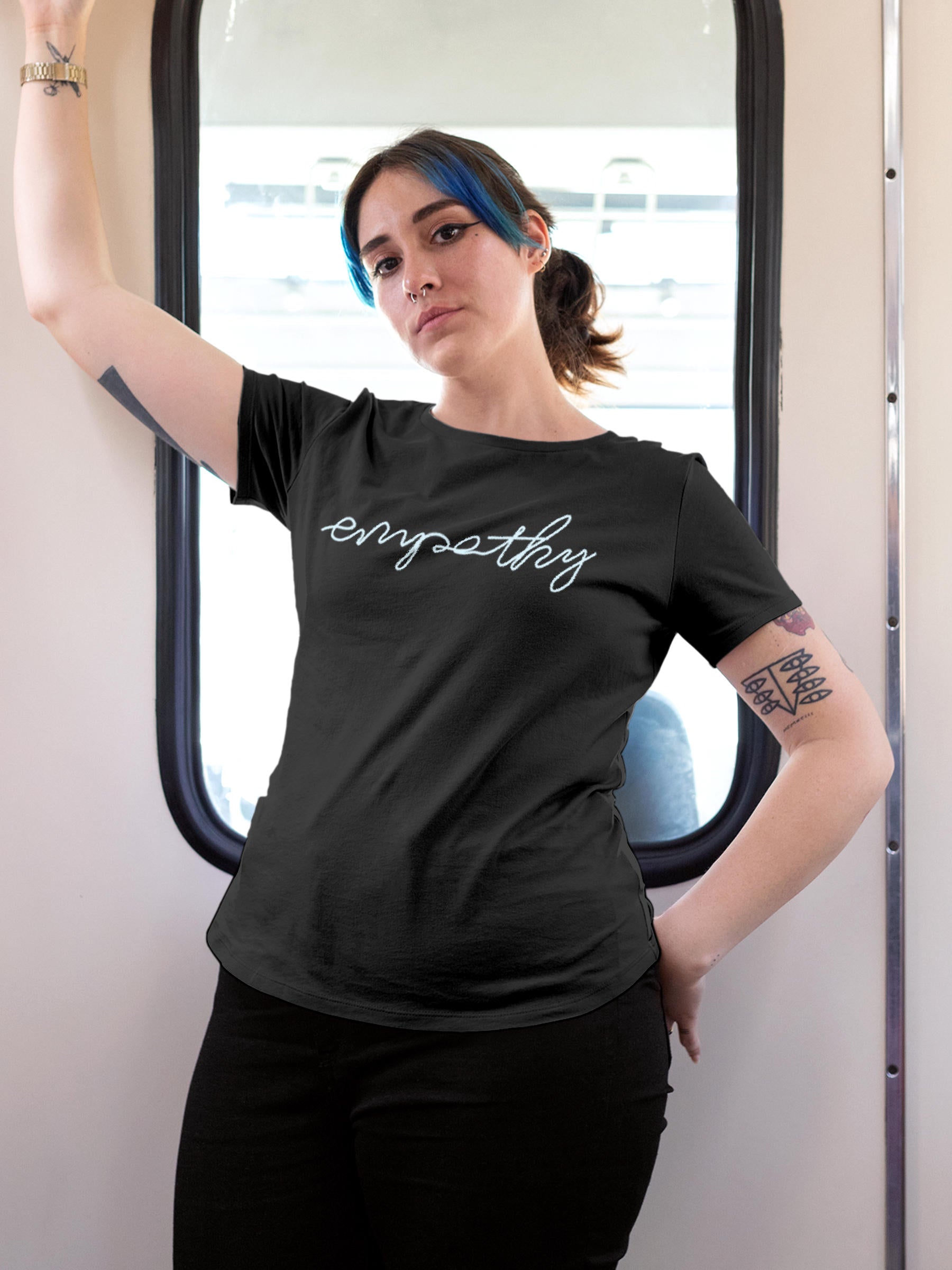 Model wearing Women's Dark Grey Round Neck T-shirt with 'Empathy' design, offering effortless style and premium comfort