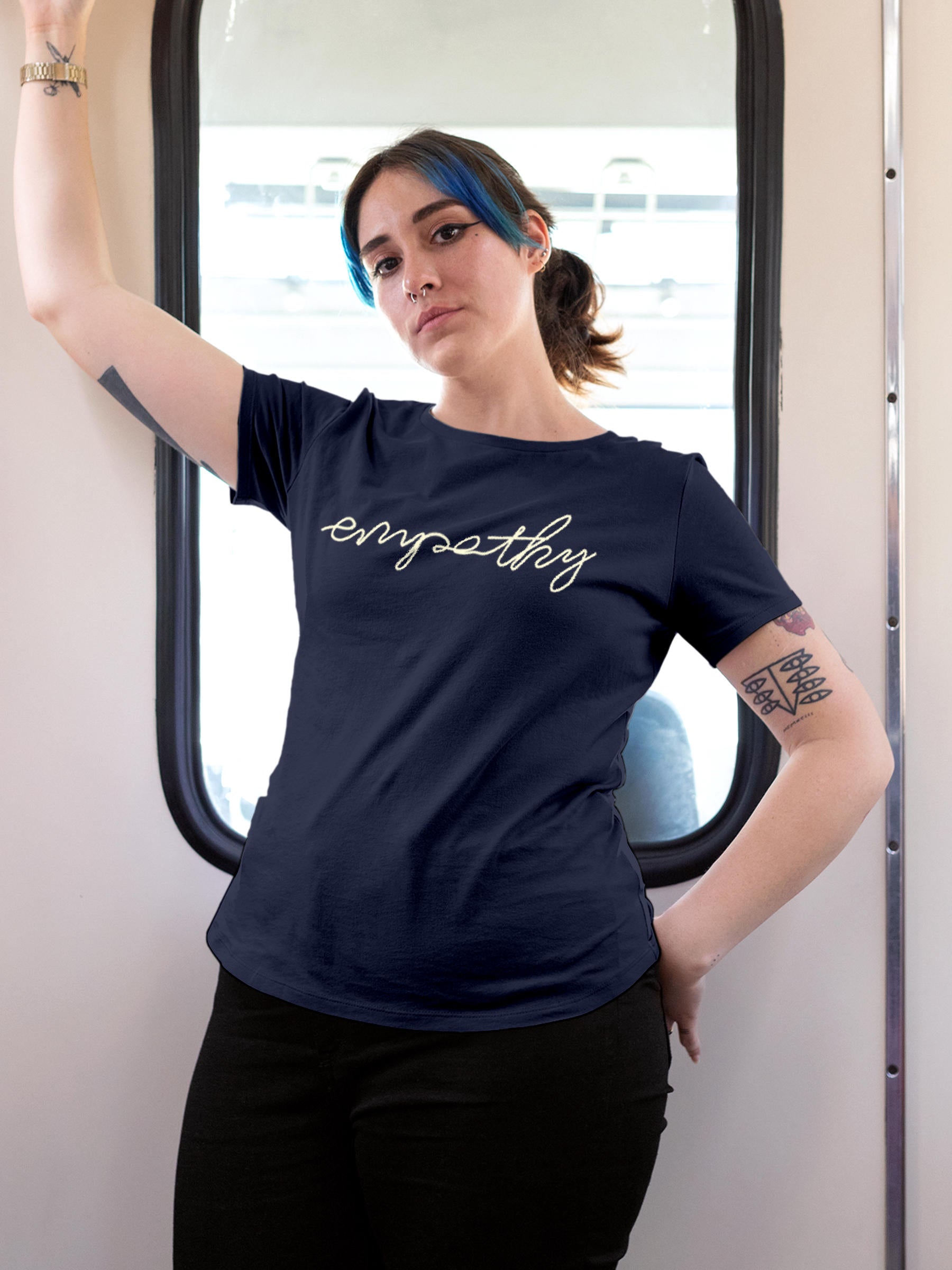 Model wearing Women's Navy Blue Round Neck T-shirt with 'Empathy' design, offering effortless style and premium comfort