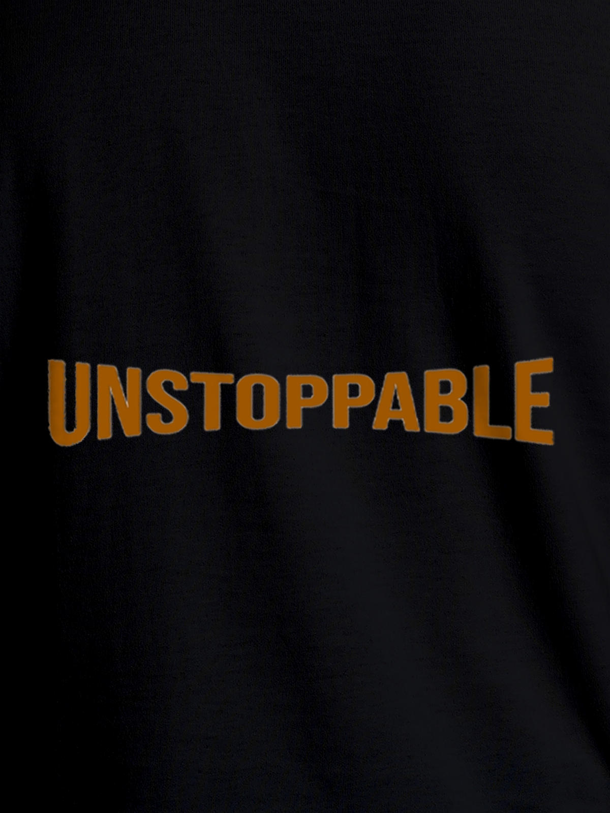 Close up of 'Unstoppable' design on Men's Black Round Neck T-shirt, highlighting intricate details and vibrant print.