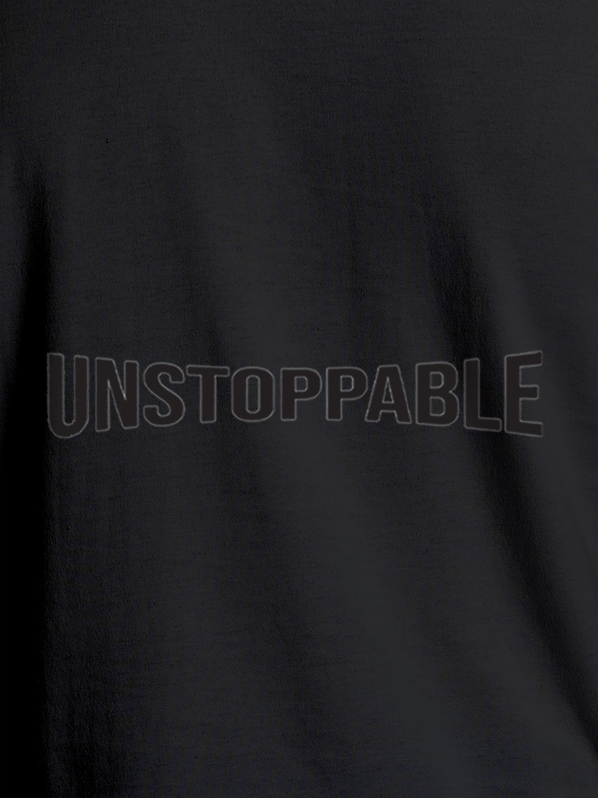 Close up of 'Unstoppable' design on Men's Dark Grey Round Neck T-shirt, highlighting intricate details and vibrant print.