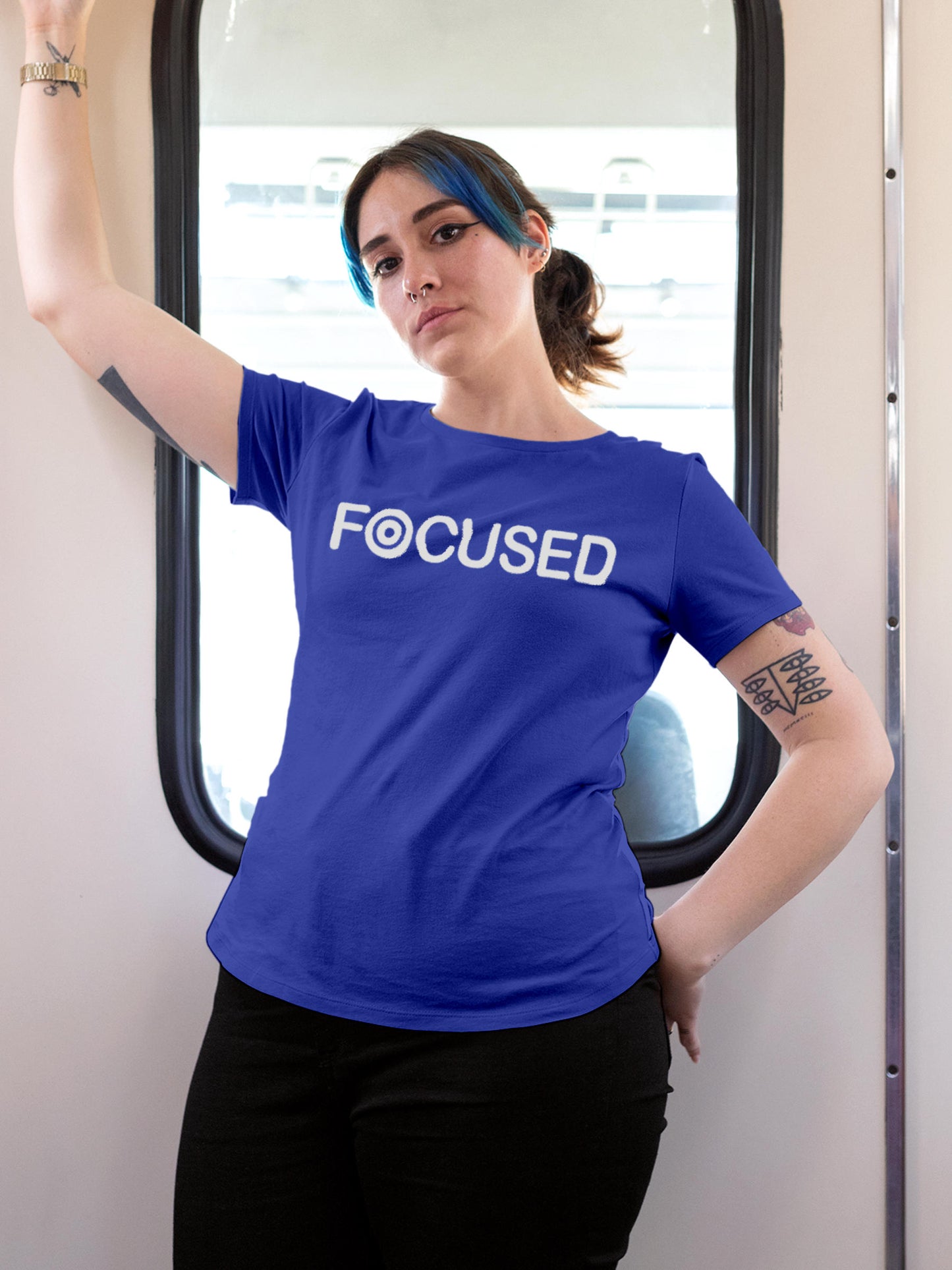 Model wearing Women's Blue Round Neck T-shirt with 'Focused' design, offering effortless style and premium comfort