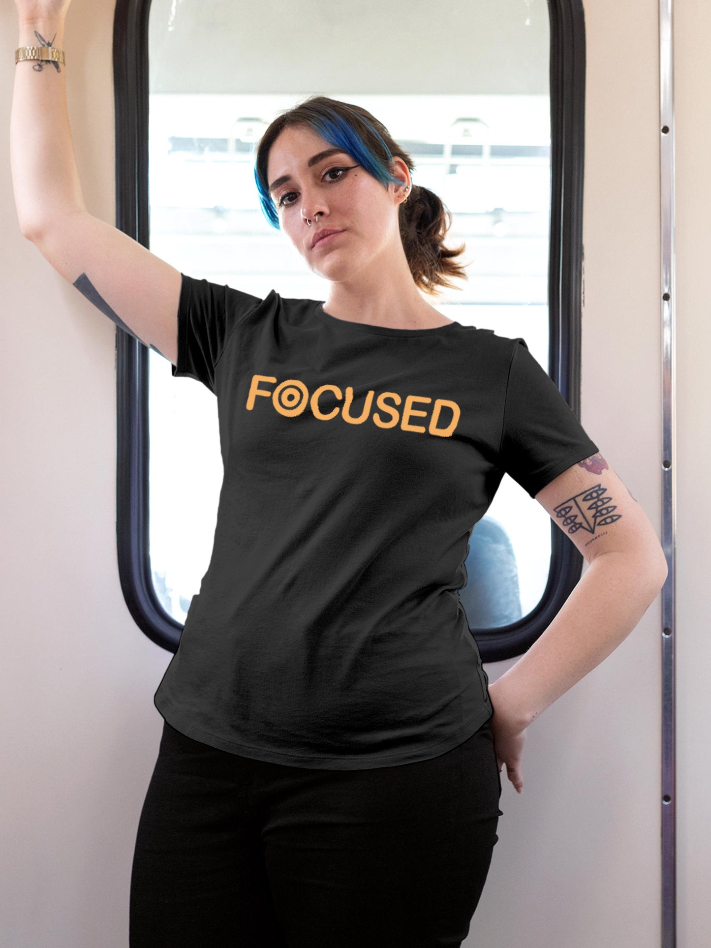 Model wearing Women's Dark Grey Round Neck T-shirt with 'Focused' design, offering effortless style and premium comfort