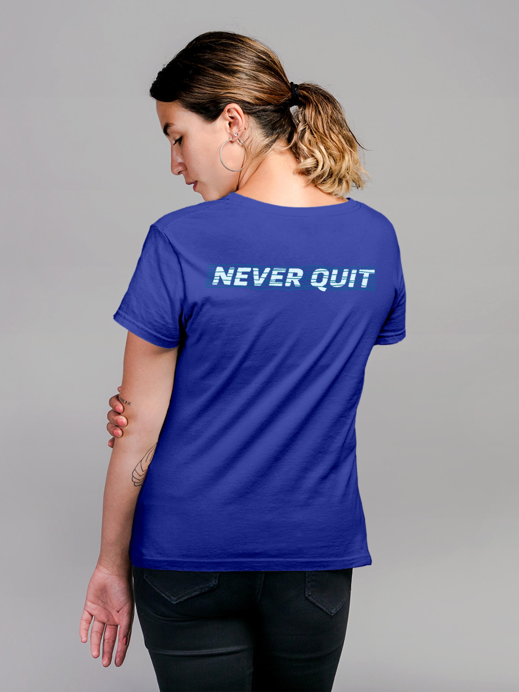 Model wearing Women's Blue Round Neck T-shirt with 'Never Quit' design, offering effortless style and premium comfort
