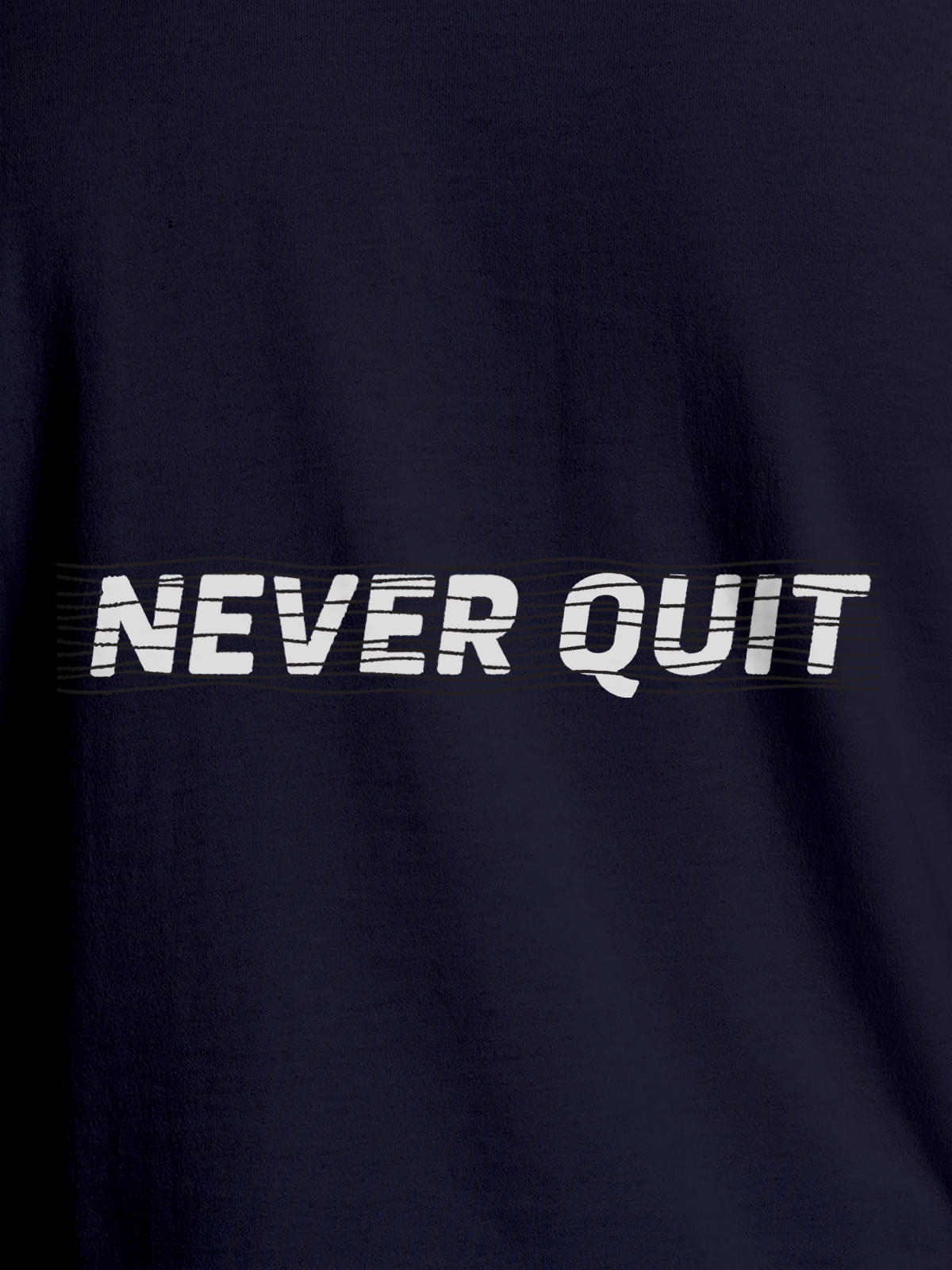 Close up of 'Never Quit' design on Women's Navy Blue Round Neck T-shirt, highlighting intricate details and vibrant print.