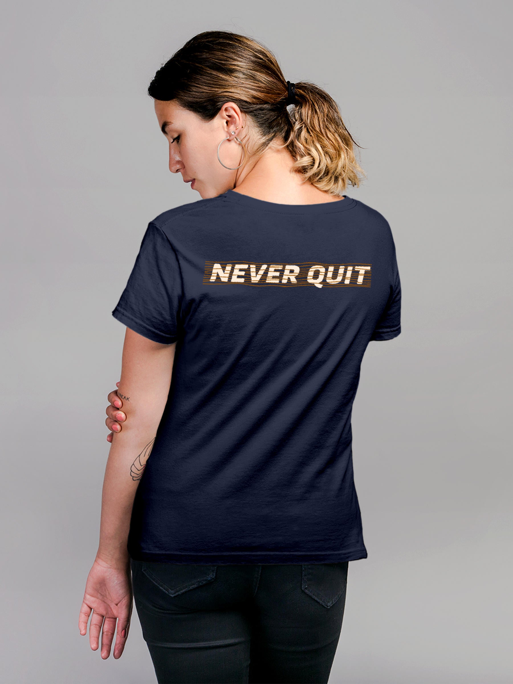 Model wearing Women's Navy Blue Round Neck T-shirt with 'Never Quit' design, offering effortless style and premium comfort