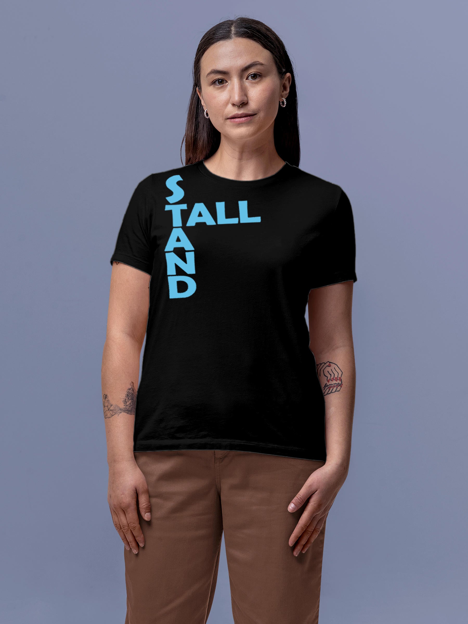 Model wearing Women's Black Round Neck T-shirt with 'Stand Tall' design, offering effortless style and premium comfort