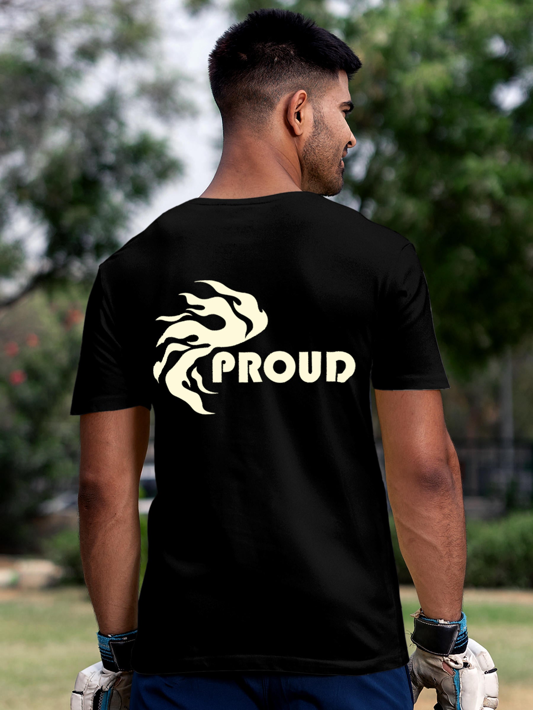 Model wearing Men's Black Round Neck T-shirt with 'Proud' design, offering effortless style and premium comfort