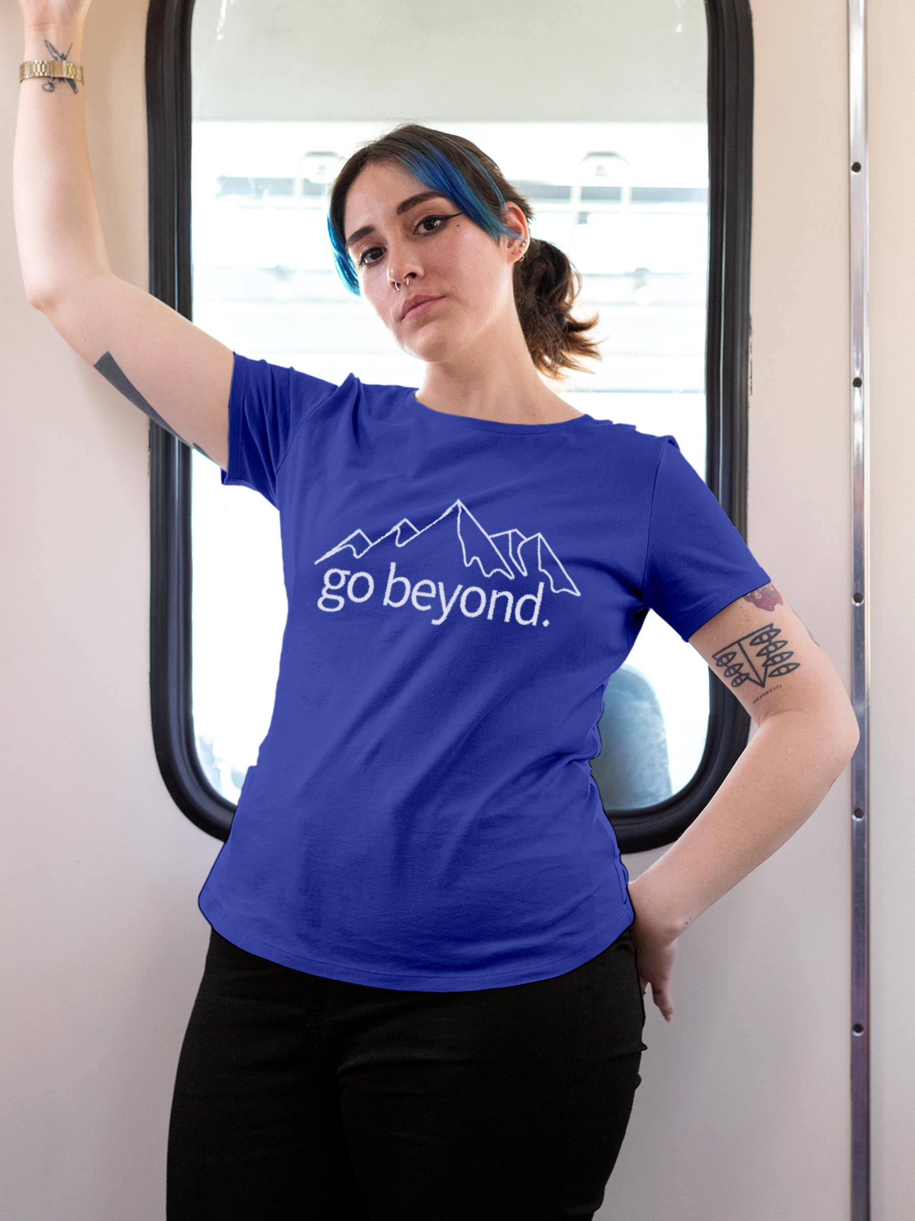 Model wearing Women's Blue Round Neck T-shirt with 'Go Beyond' design, offering effortless style and premium comfort