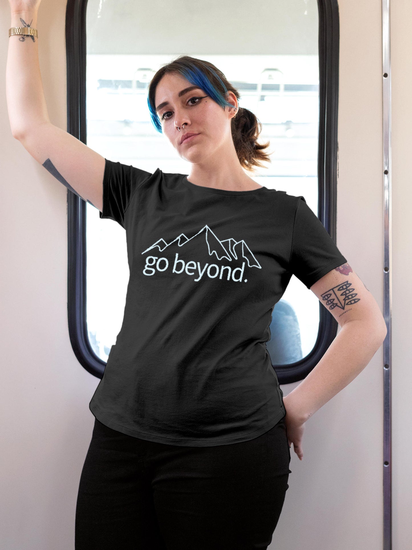 Model wearing Women's Dark Grey Round Neck T-shirt with 'Go Beyond' design, offering effortless style and premium comfort