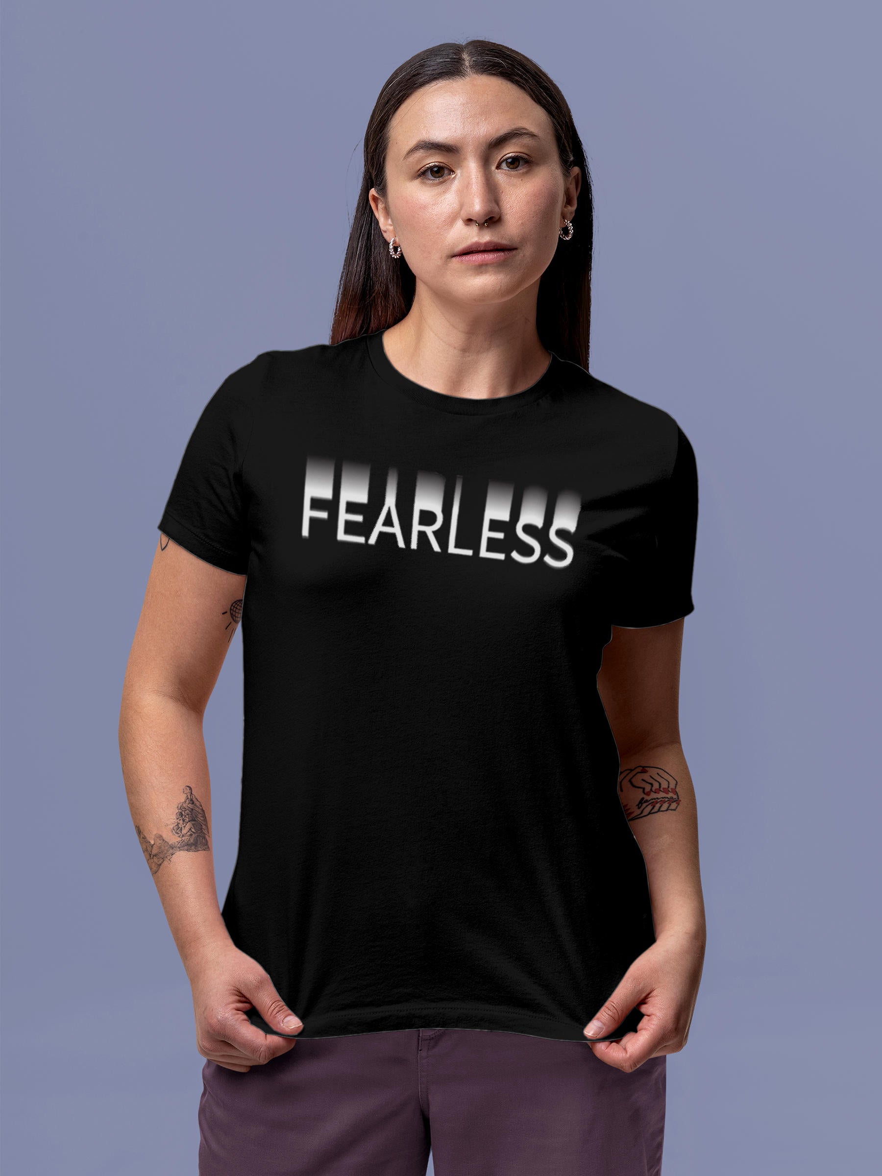 Model wearing Women's Black Round Neck T-shirt with 'Fearless' design, offering effortless style and premium comfort