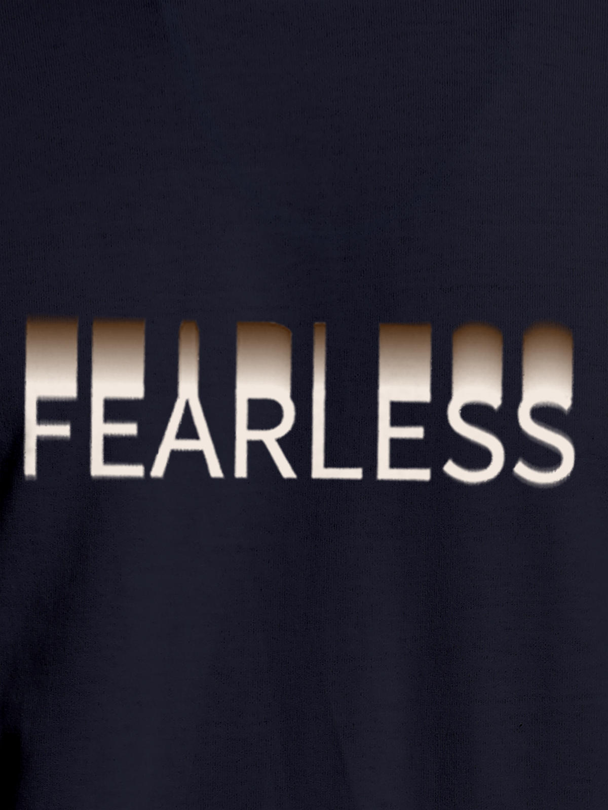 Close up of 'Fearless' design on Men's Navy Blue Round Neck T-shirt, highlighting intricate details and vibrant print.