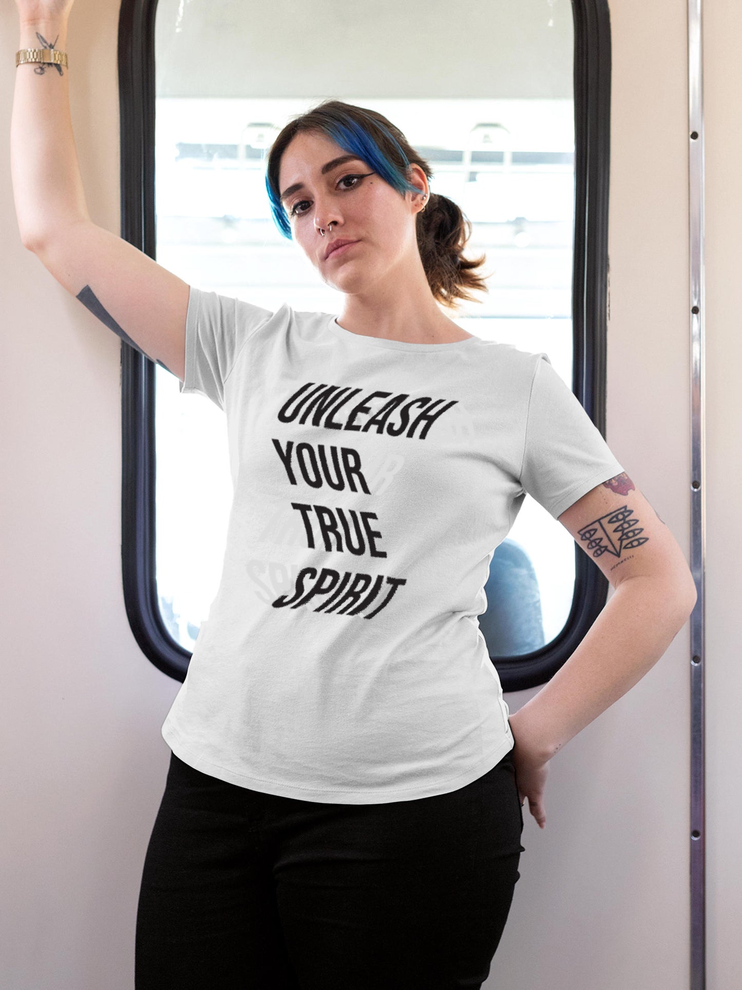 Model wearing Women's White Round Neck T-shirt with 'Unleash Your True Spirit' design, offering effortless style and premium comfort
