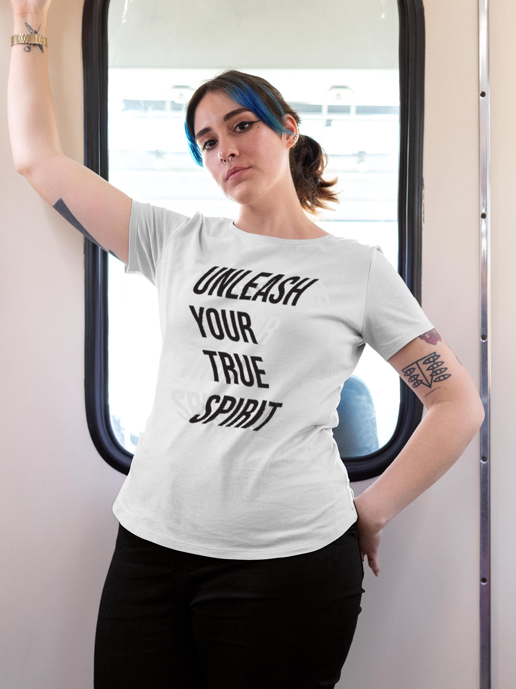 Model wearing Women's White Round Neck T-shirt with 'Unleash Your True Spirit' design, offering effortless style and premium comfort