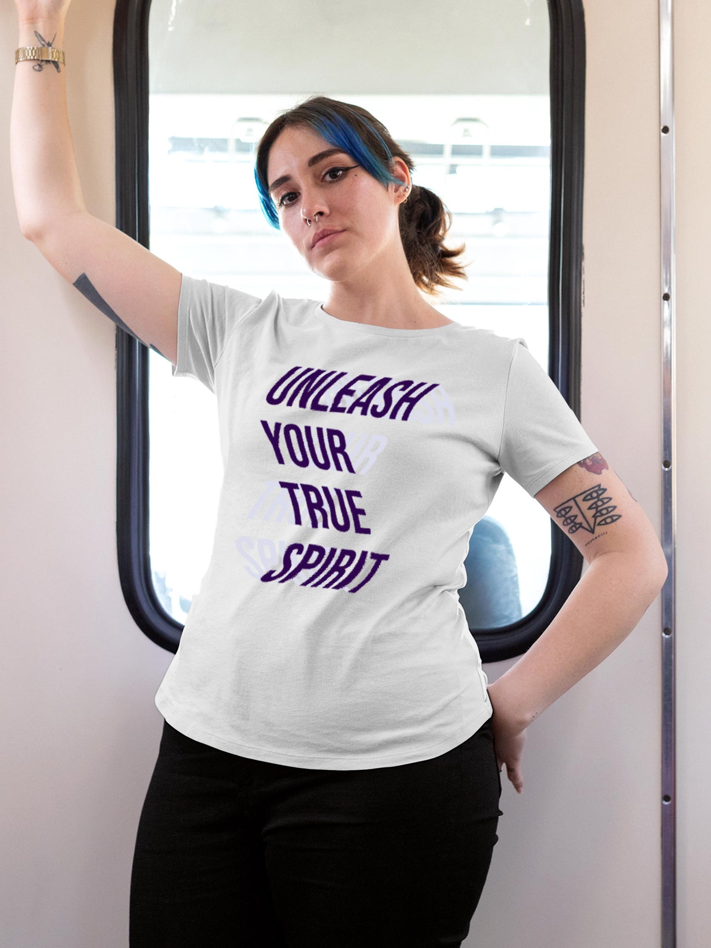 Model wearing Women's White Round Neck T-shirt with 'Unleash Your True Spirit' design, offering effortless style and premium comfort