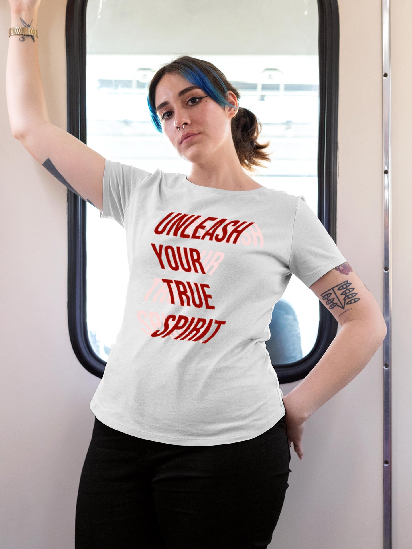 Model wearing Women's White Round Neck T-shirt with 'Unleash Your True Spirit' design, offering effortless style and premium comfort