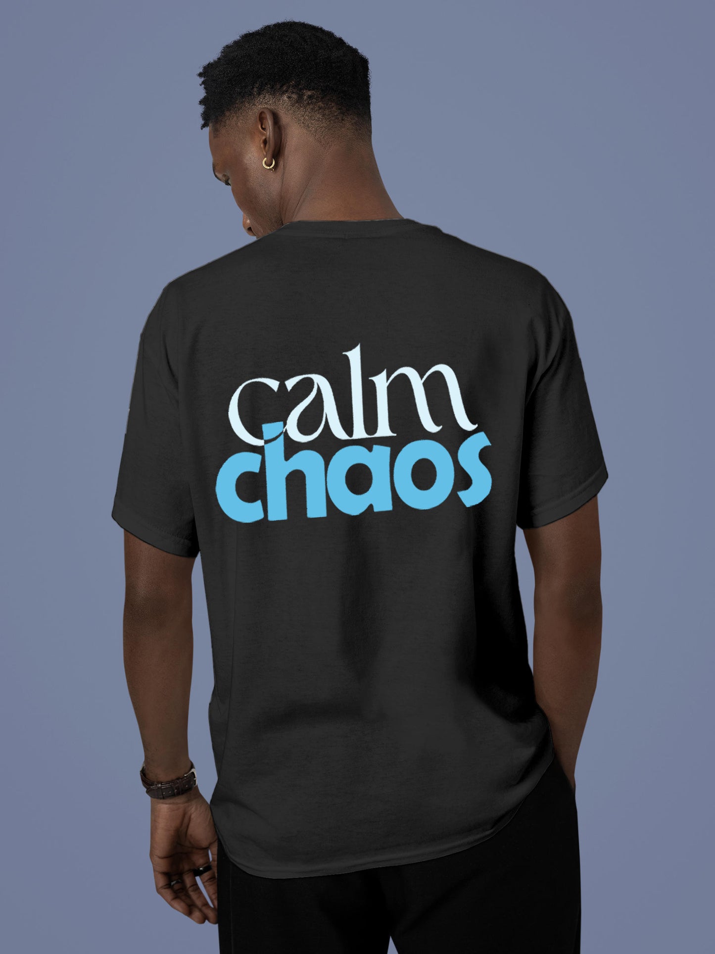 Model wearing Men's Dark Grey Round Neck T-shirt with 'Calm Chaos' design, offering effortless style and premium comfort