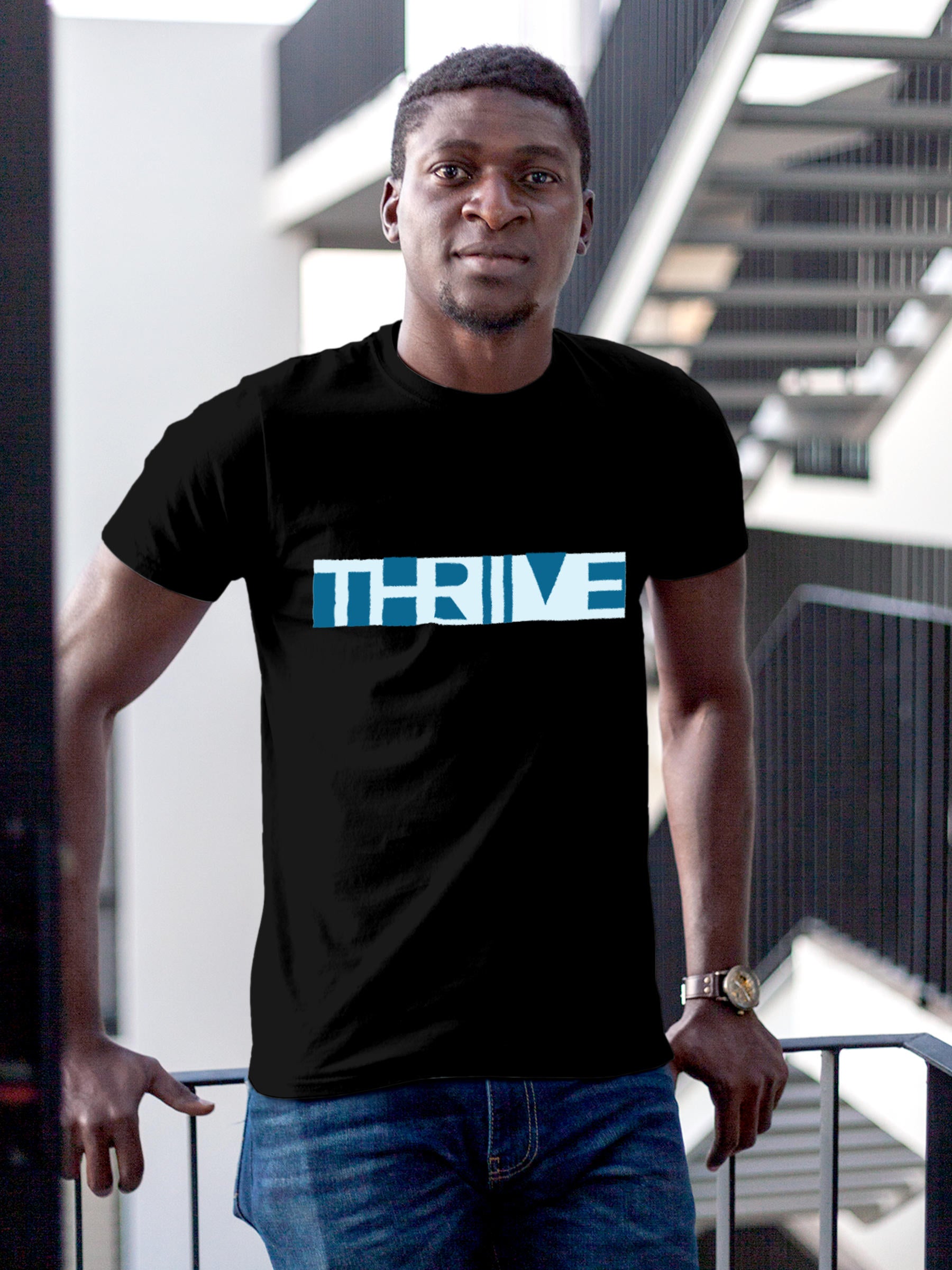 Model wearing Men's Black Round Neck T-shirt with 'Thrive' design, offering effortless style and premium comfort