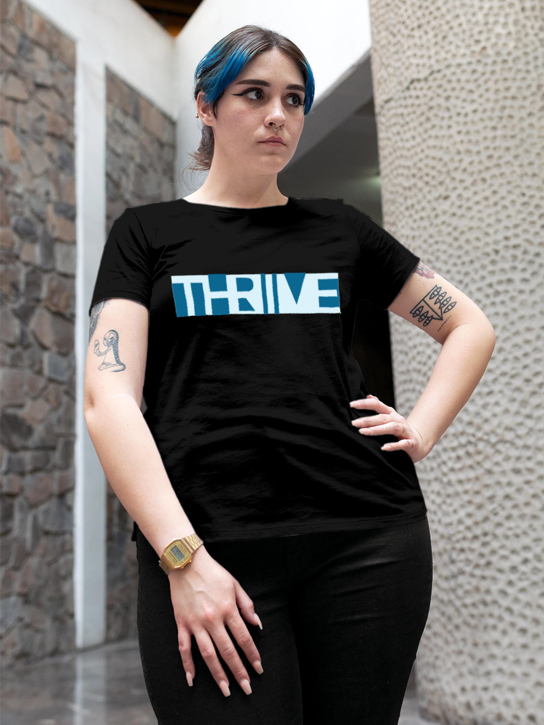Model wearing Women's Black Round Neck T-shirt with 'Thrive' design, offering effortless style and premium comfort