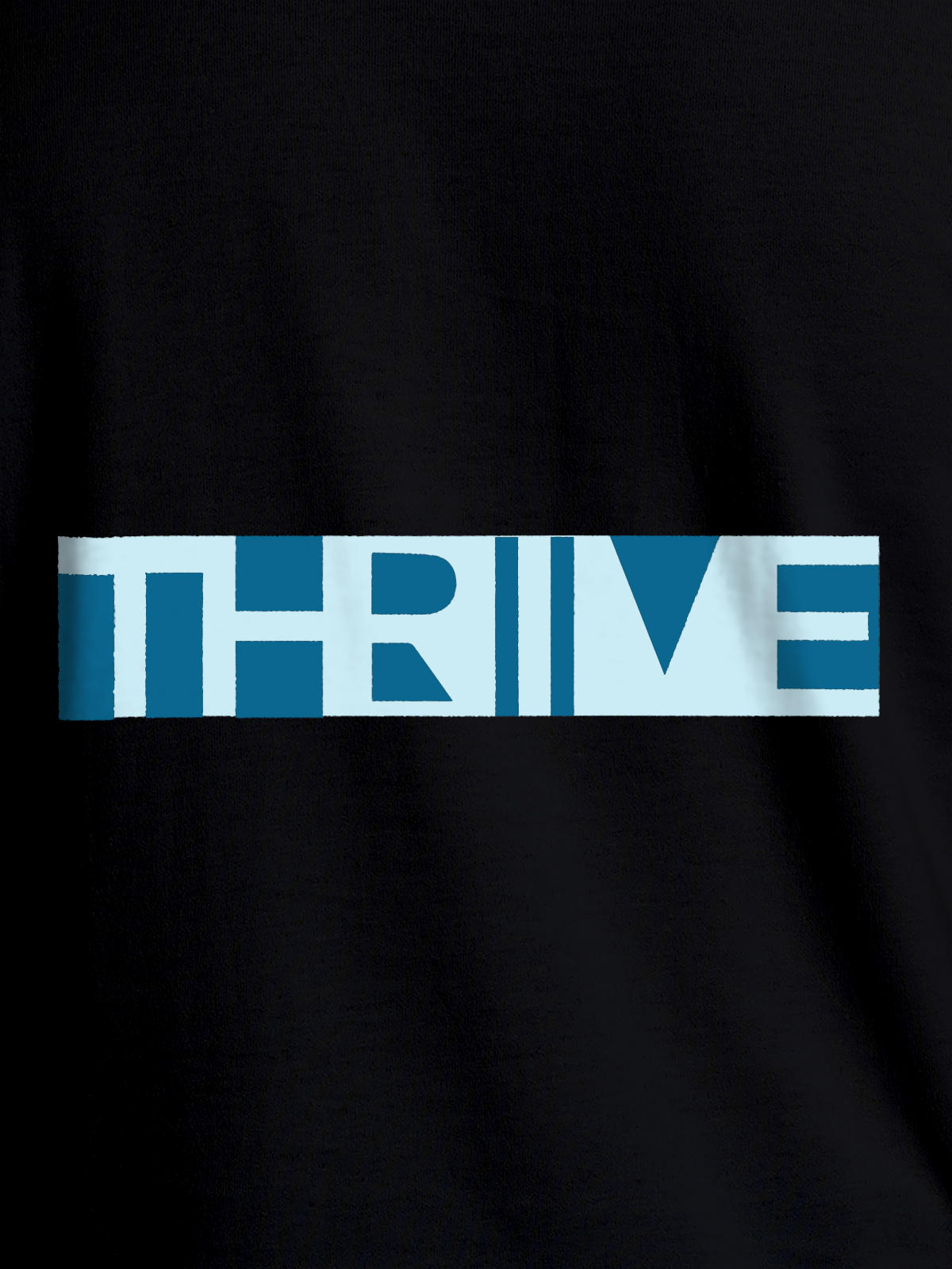 Close up of 'Thrive' design on Women's Black Round Neck T-shirt, highlighting intricate details and vibrant print.