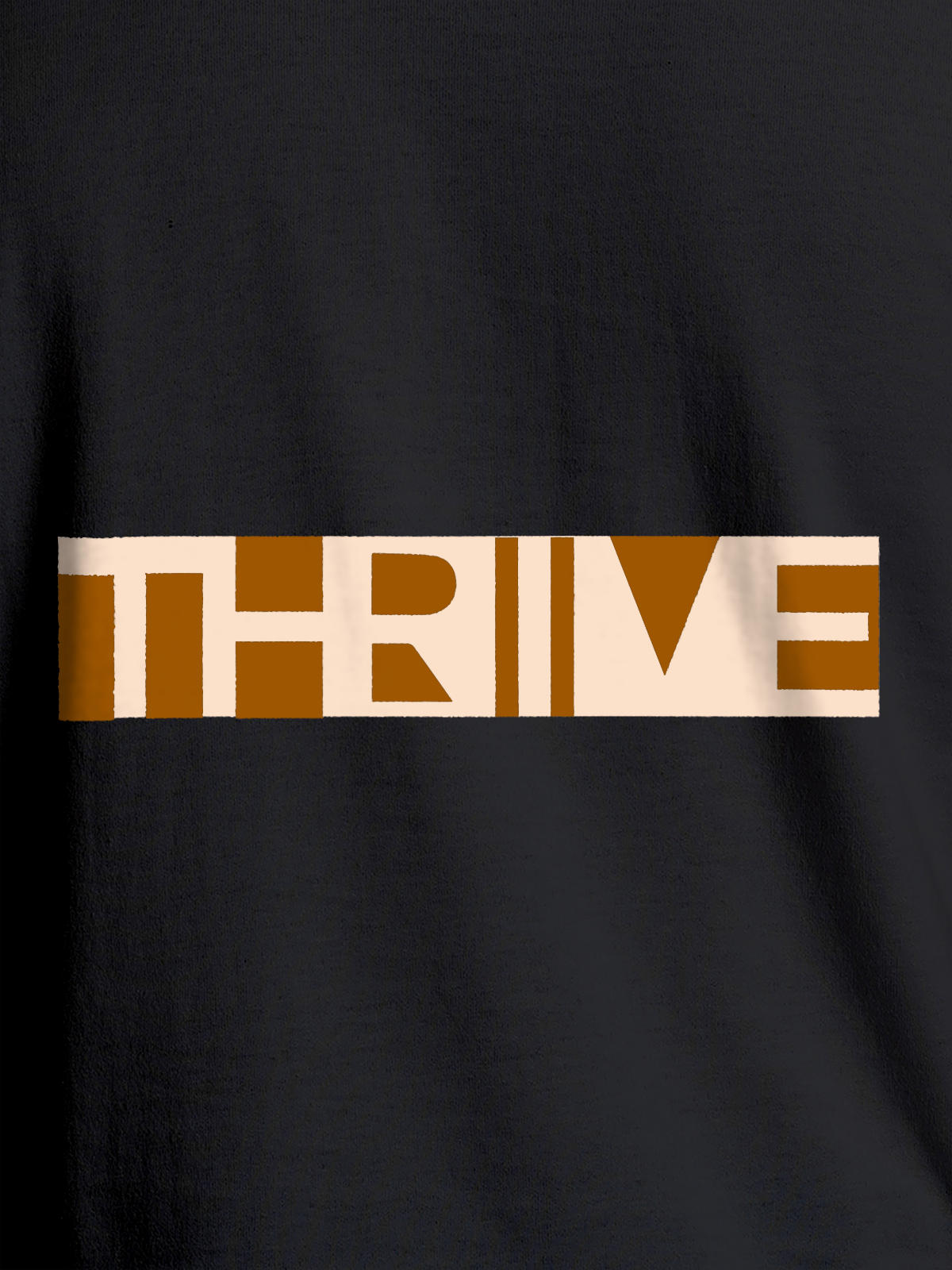 Close up of 'Thrive' design on Women's Dark Grey Round Neck T-shirt, highlighting intricate details and vibrant print.
