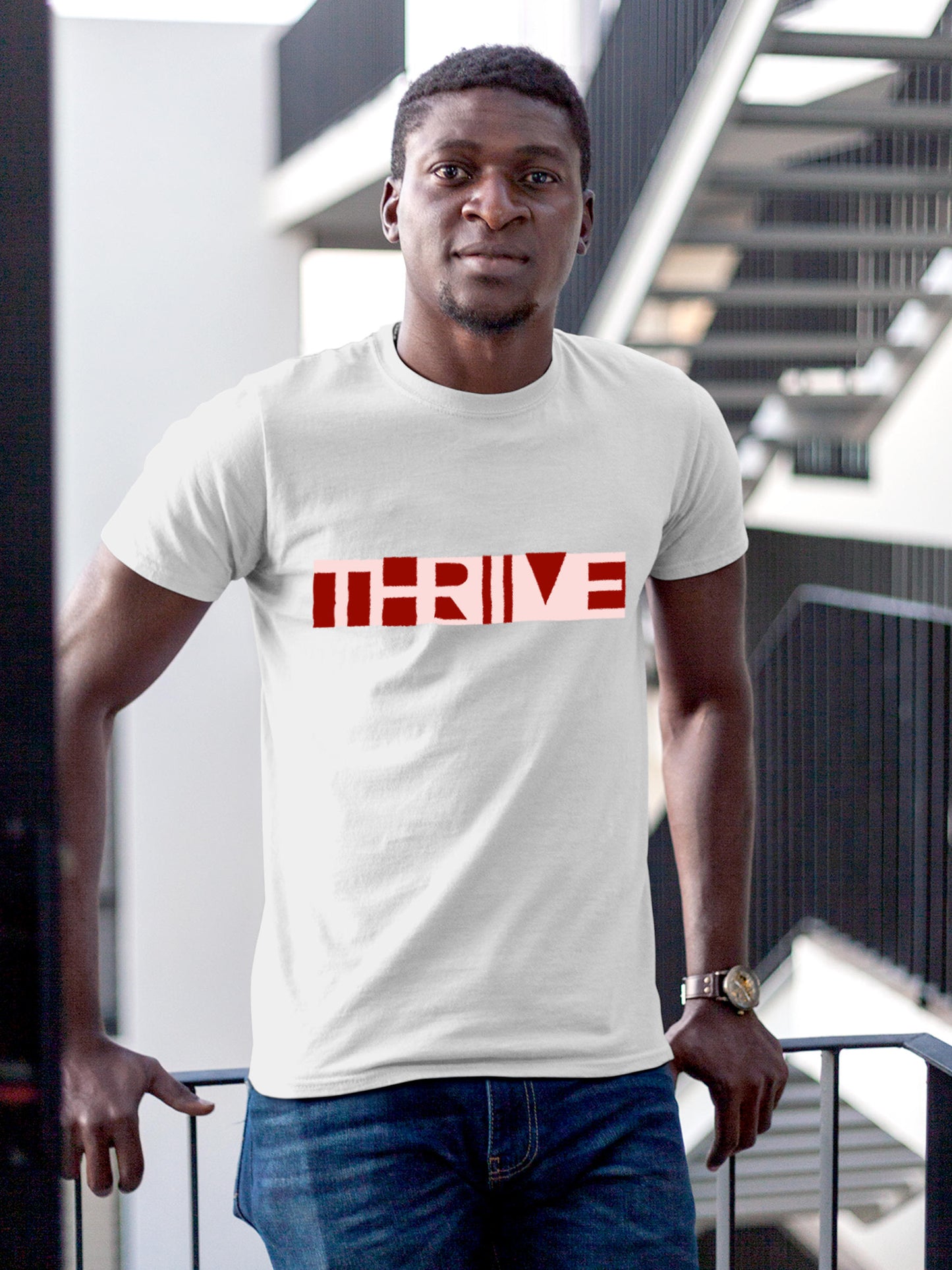 Model wearing Men's White Round Neck T-shirt with 'Thrive' design, offering effortless style and premium comfort