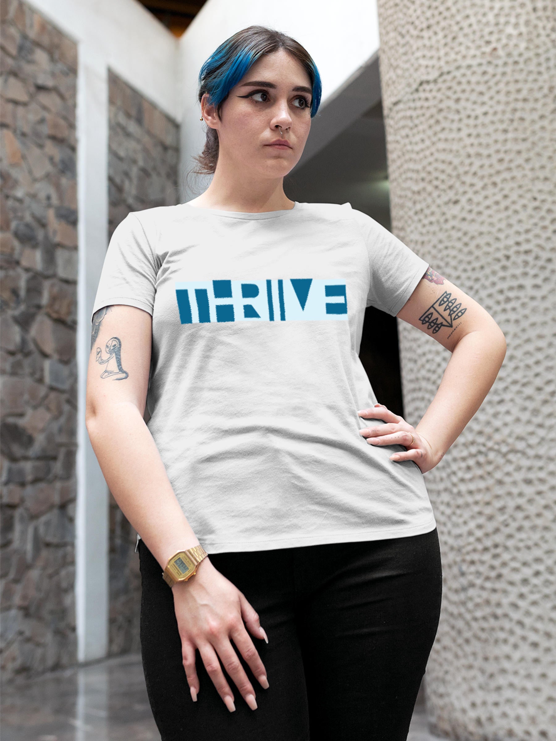 Model wearing Women's White Round Neck T-shirt with 'Thrive' design, offering effortless style and premium comfort