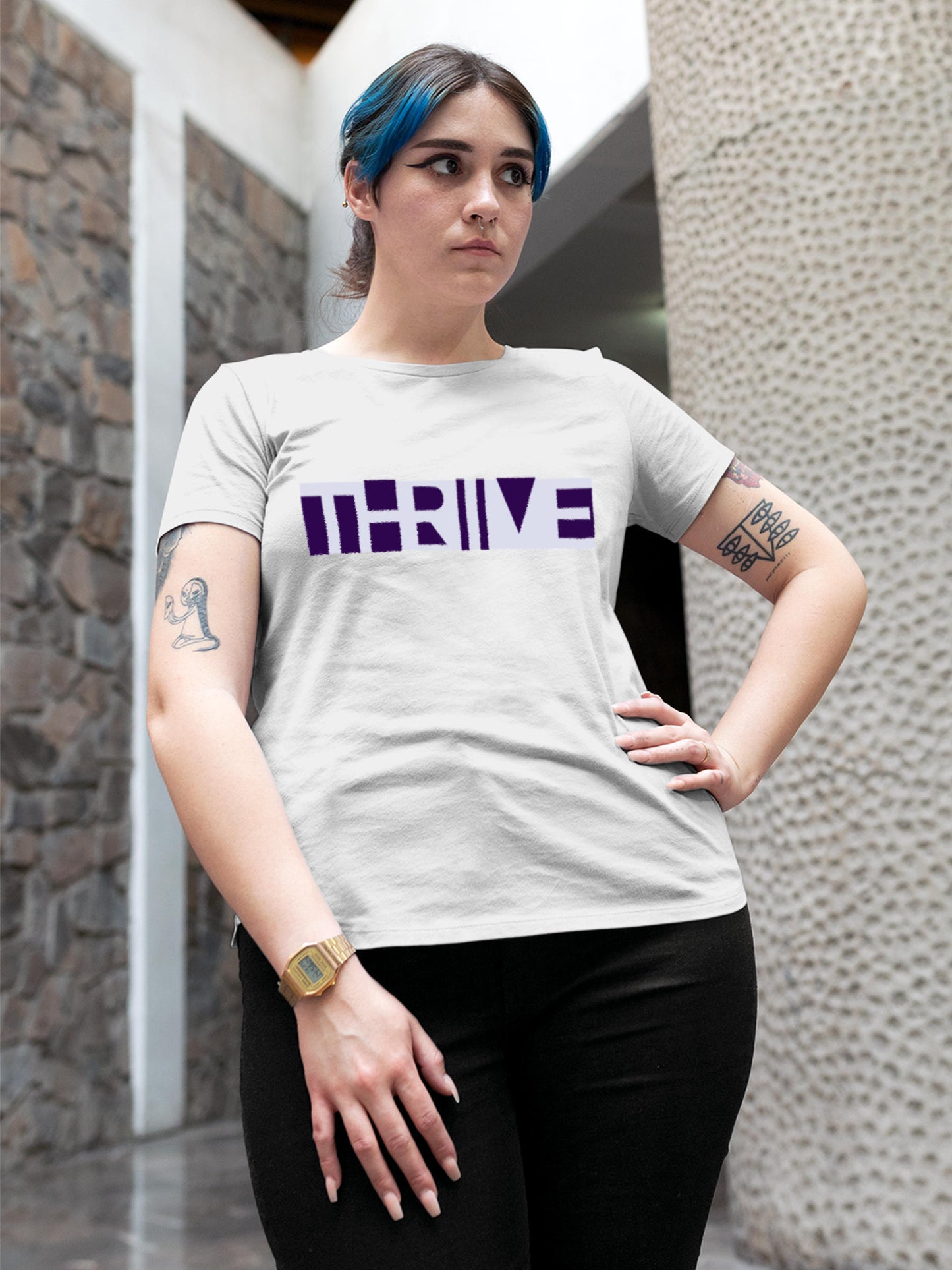 Model wearing Women's White Round Neck T-shirt with 'Thrive' design, offering effortless style and premium comfort