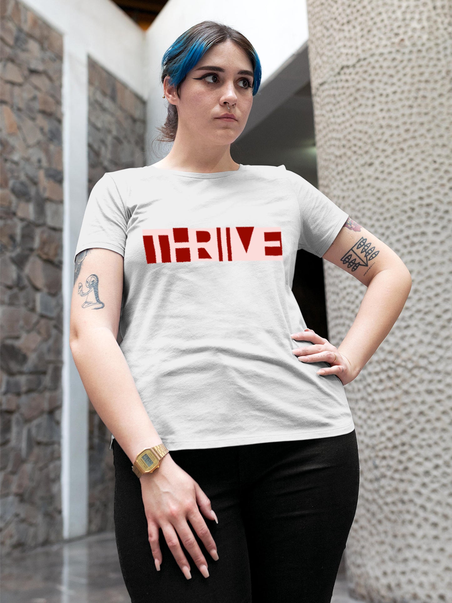 Model wearing Women's White Round Neck T-shirt with 'Thrive' design, offering effortless style and premium comfort