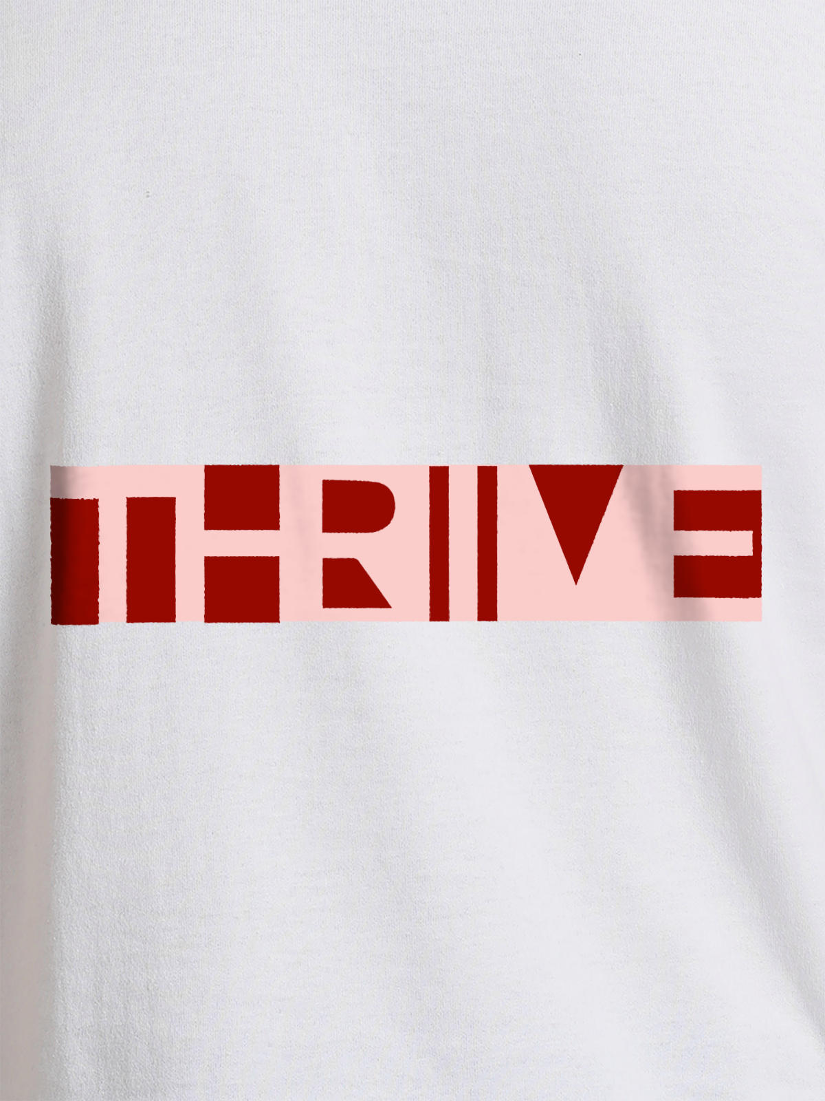 Close up of 'Thrive' design on Women's White Round Neck T-shirt, highlighting intricate details and vibrant print.