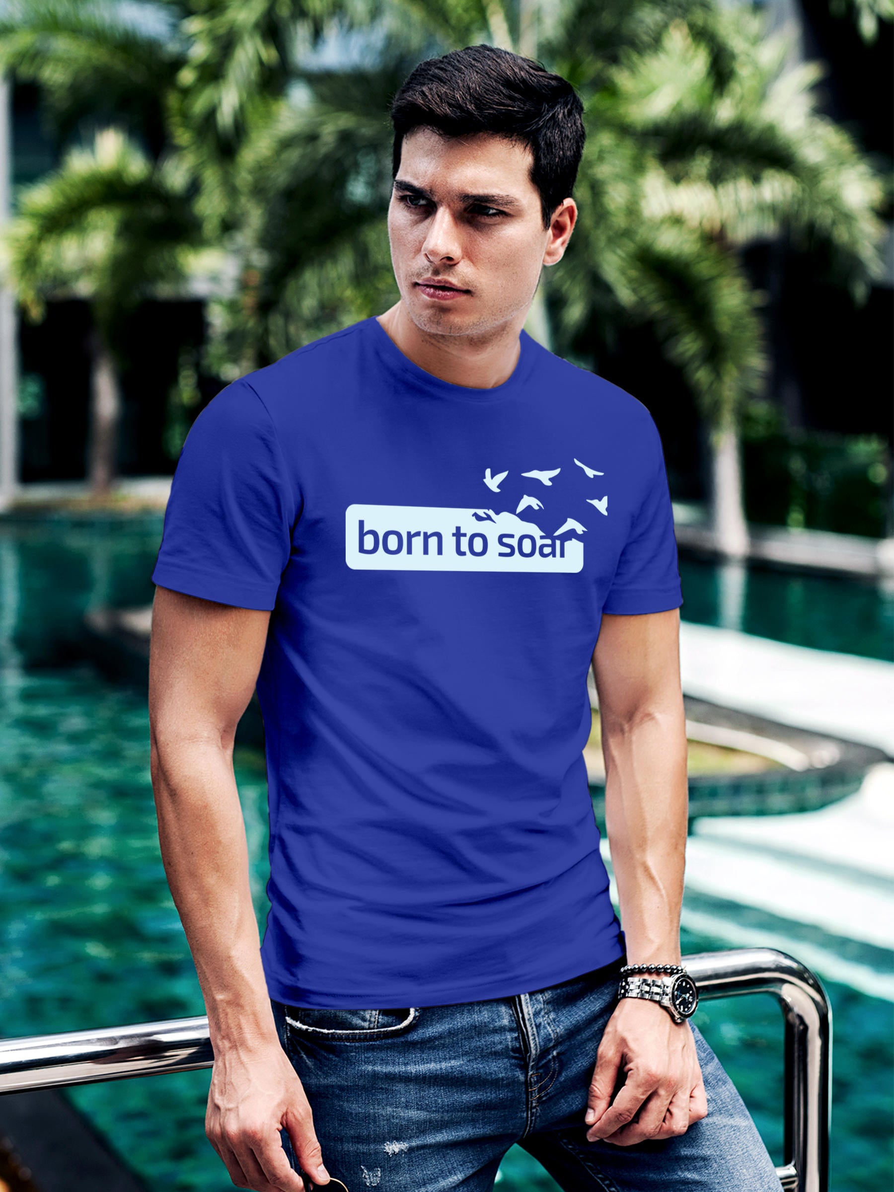Model wearing Men's Blue Round Neck T-shirt with 'Born To Soar' design, offering effortless style and premium comfort