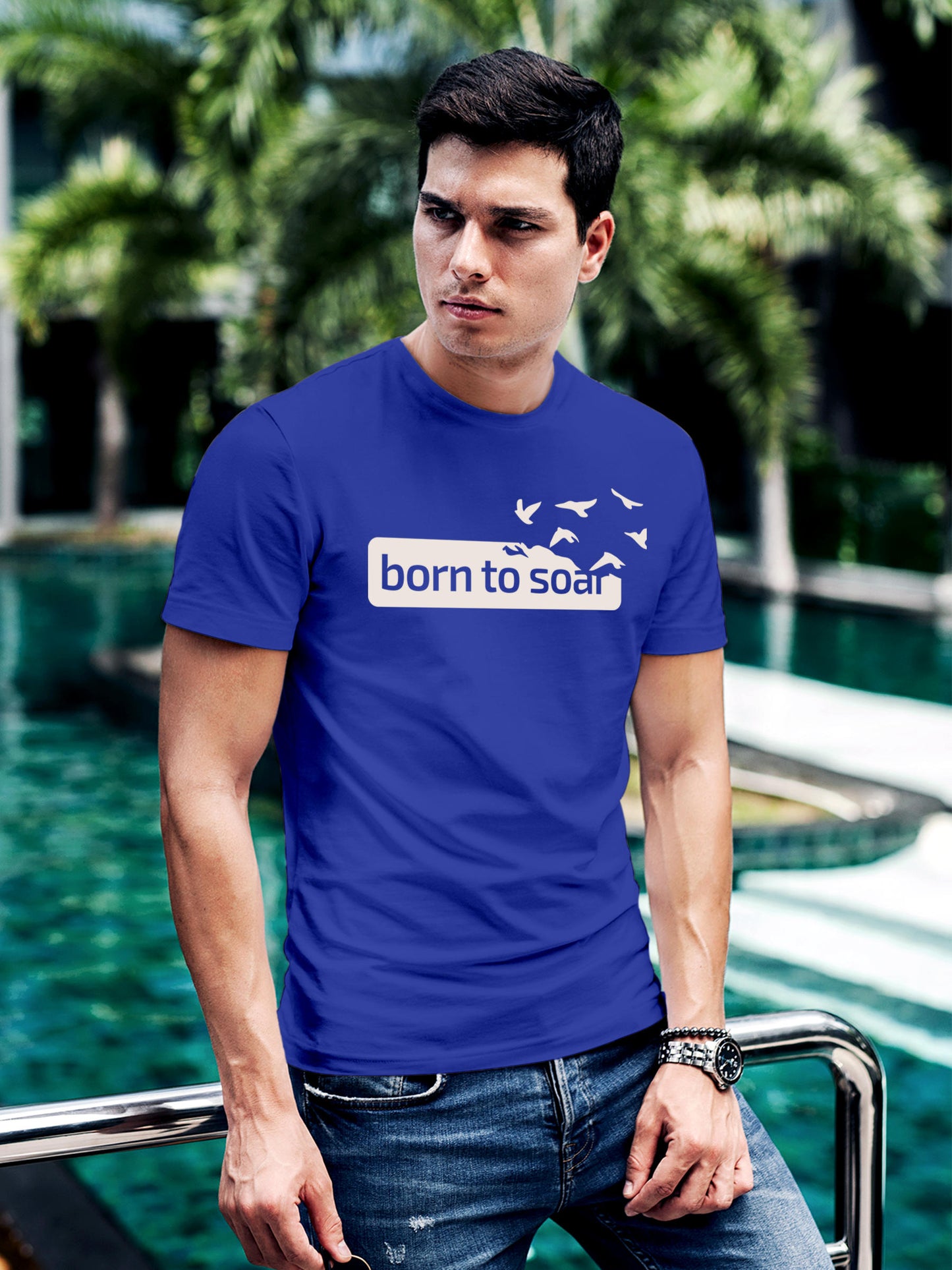 Model wearing Men's Blue Round Neck T-shirt with 'Born To Soar' design, offering effortless style and premium comfort