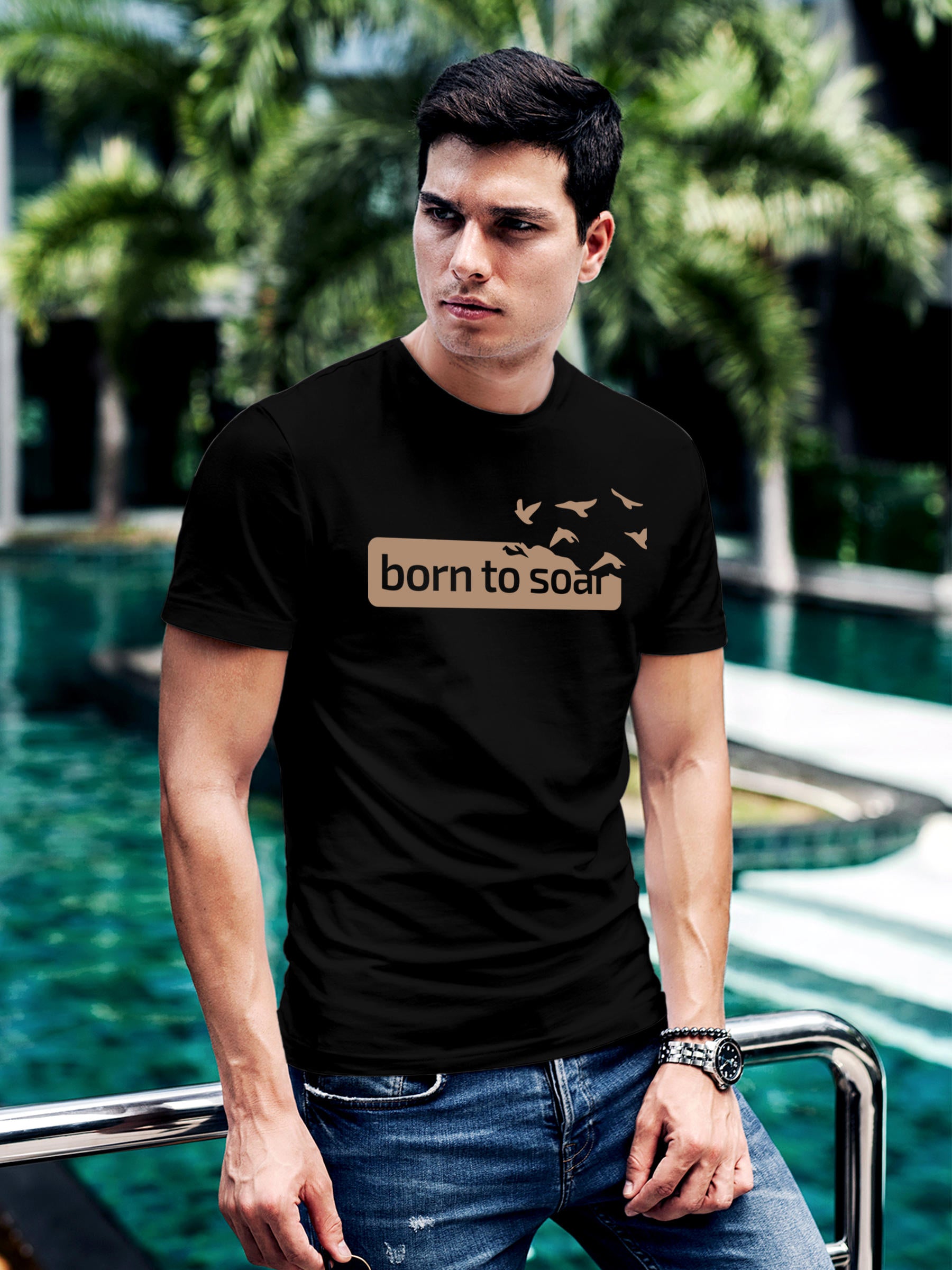 Model wearing Men's Black Round Neck T-shirt with 'Born To Soar' design, offering effortless style and premium comfort
