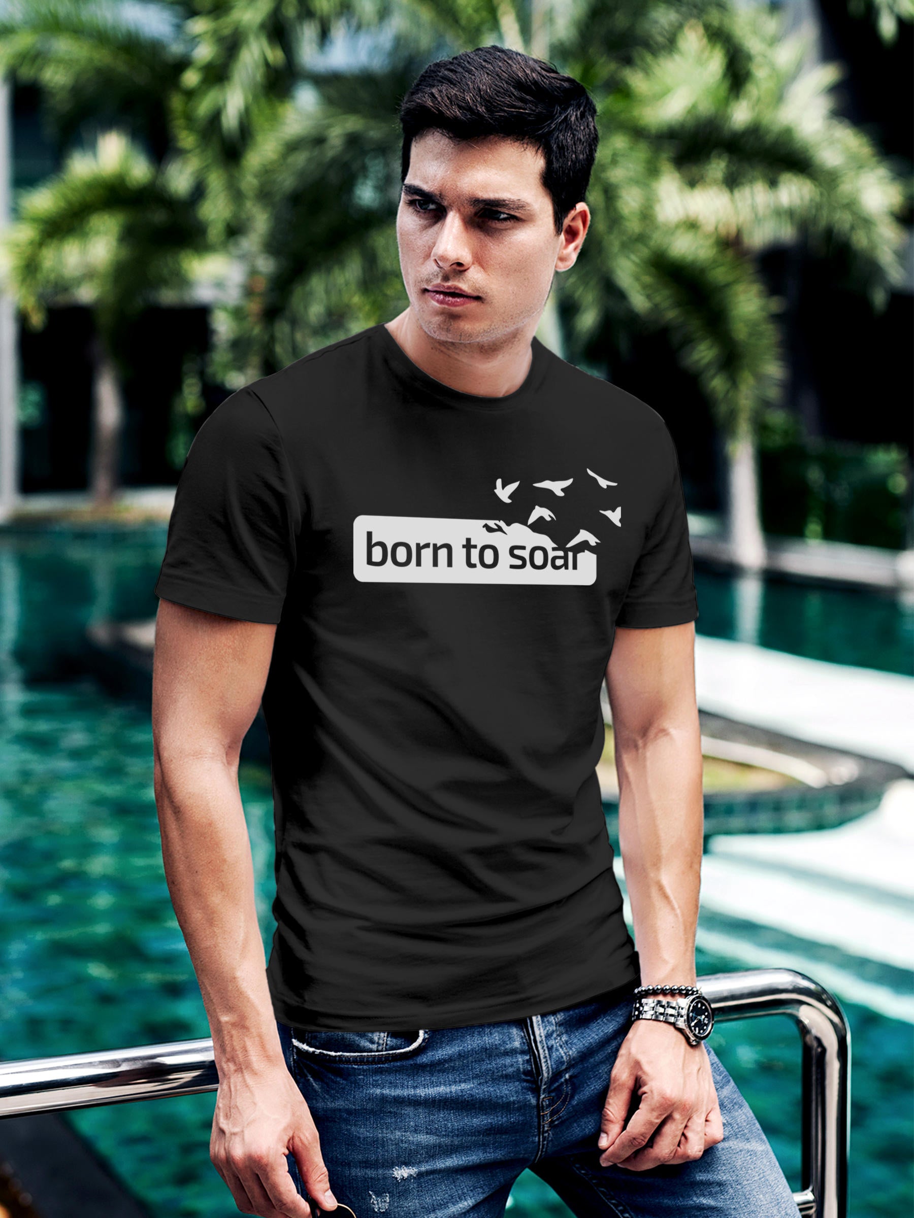 Model wearing Men's Dark Grey Round Neck T-shirt with 'Born To Soar' design, offering effortless style and premium comfort