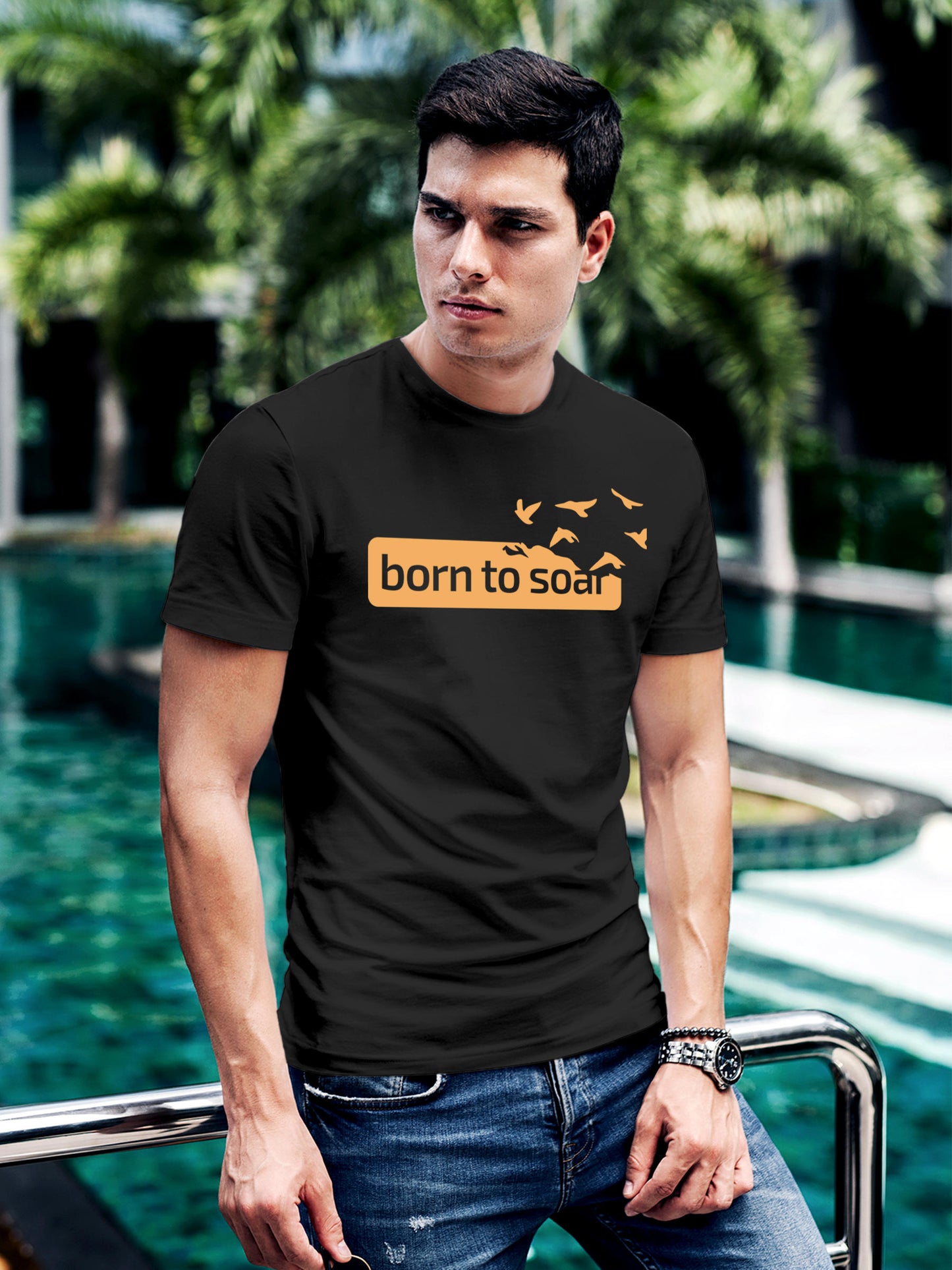 Model wearing Men's Dark Grey Round Neck T-shirt with 'Born To Soar' design, offering effortless style and premium comfort