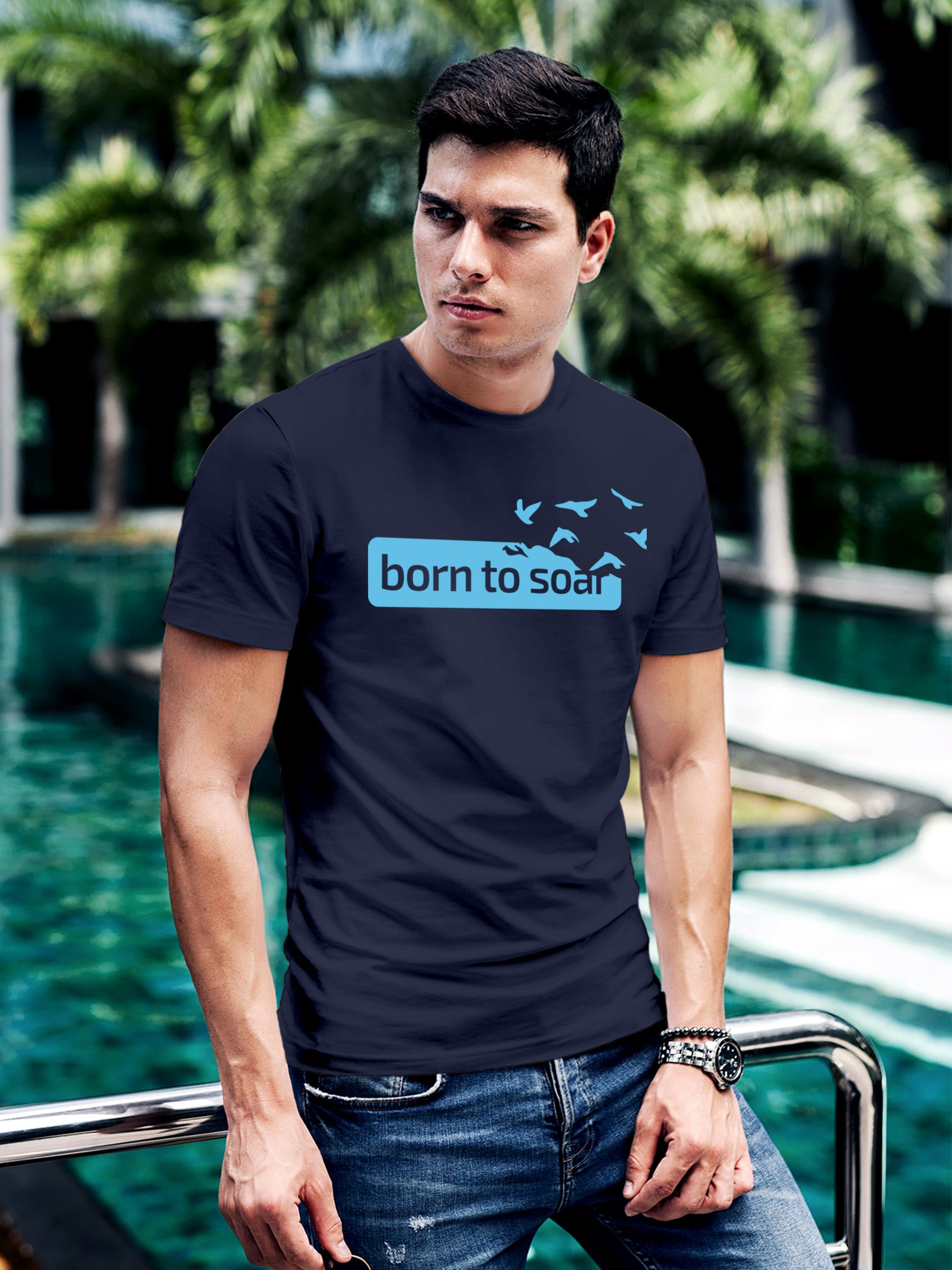 Model wearing Men's Navy Blue Round Neck T-shirt with 'Born To Soar' design, offering effortless style and premium comfort