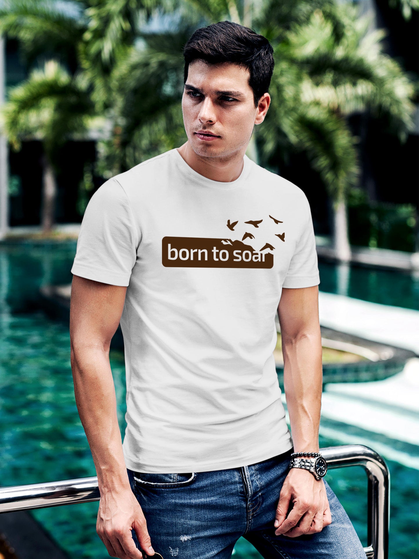 Model wearing Men's White Round Neck T-shirt with 'Born To Soar' design, offering effortless style and premium comfort