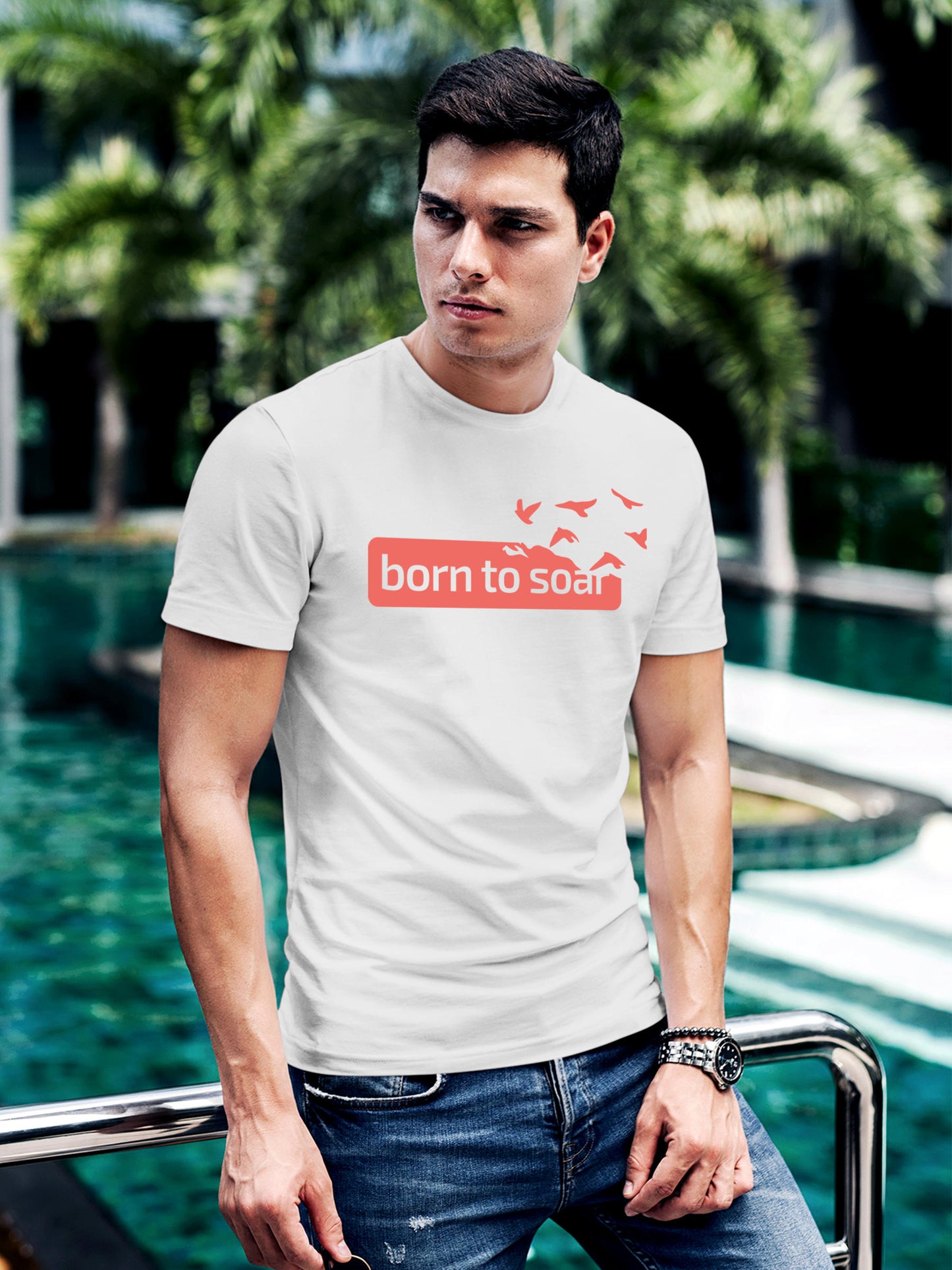 Model wearing Men's White Round Neck T-shirt with 'Born To Soar' design, offering effortless style and premium comfort
