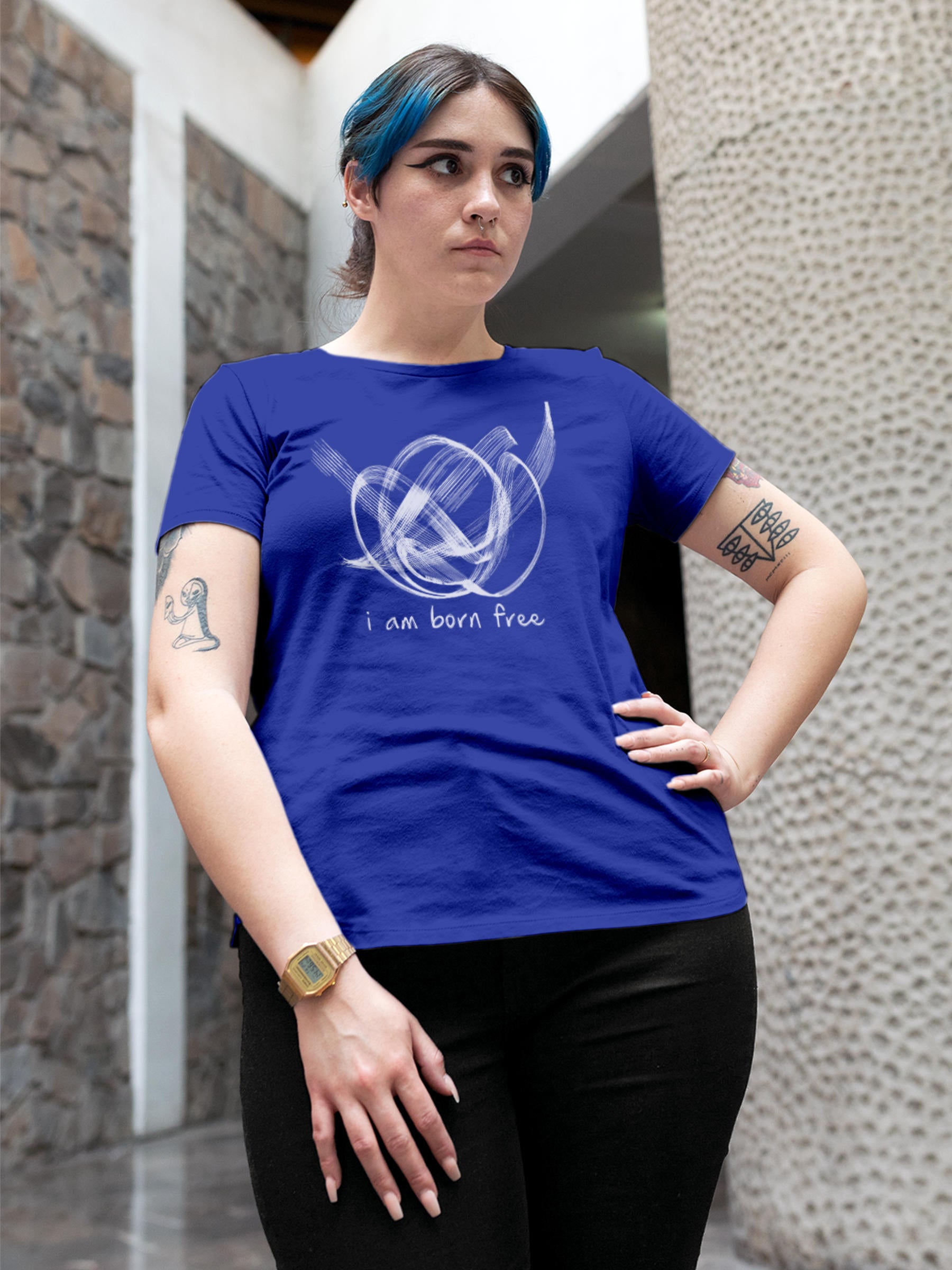 Model wearing Women's Blue Round Neck T-shirt with 'Born Free' design, offering effortless style and premium comfort