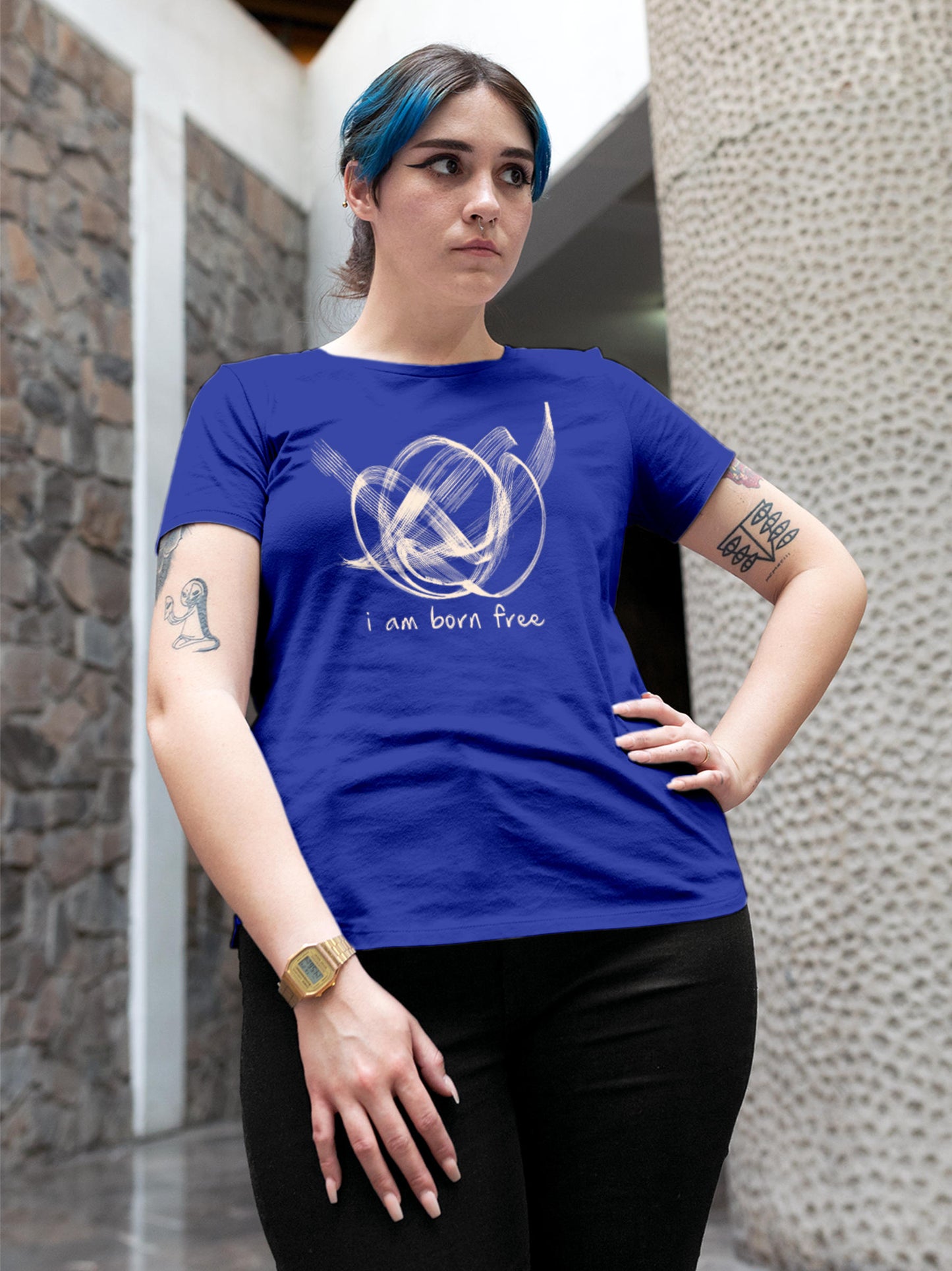 Model wearing Women's Blue Round Neck T-shirt with 'Born Free' design, offering effortless style and premium comfort